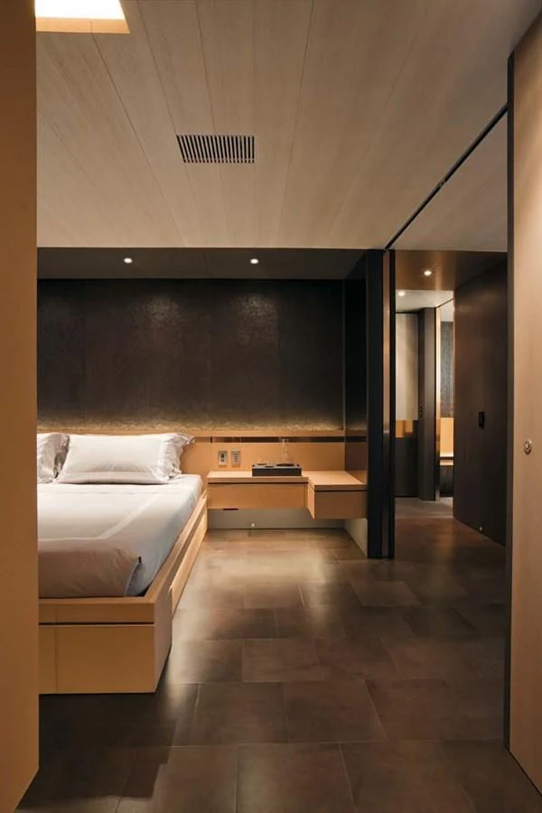 a room with a bed and a mirror aboard ENTERPRISE Yacht for Sale