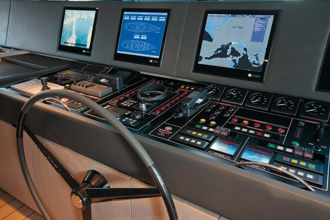 a control panel with monitors and keyboards aboard ENTERPRISE Yacht for Sale