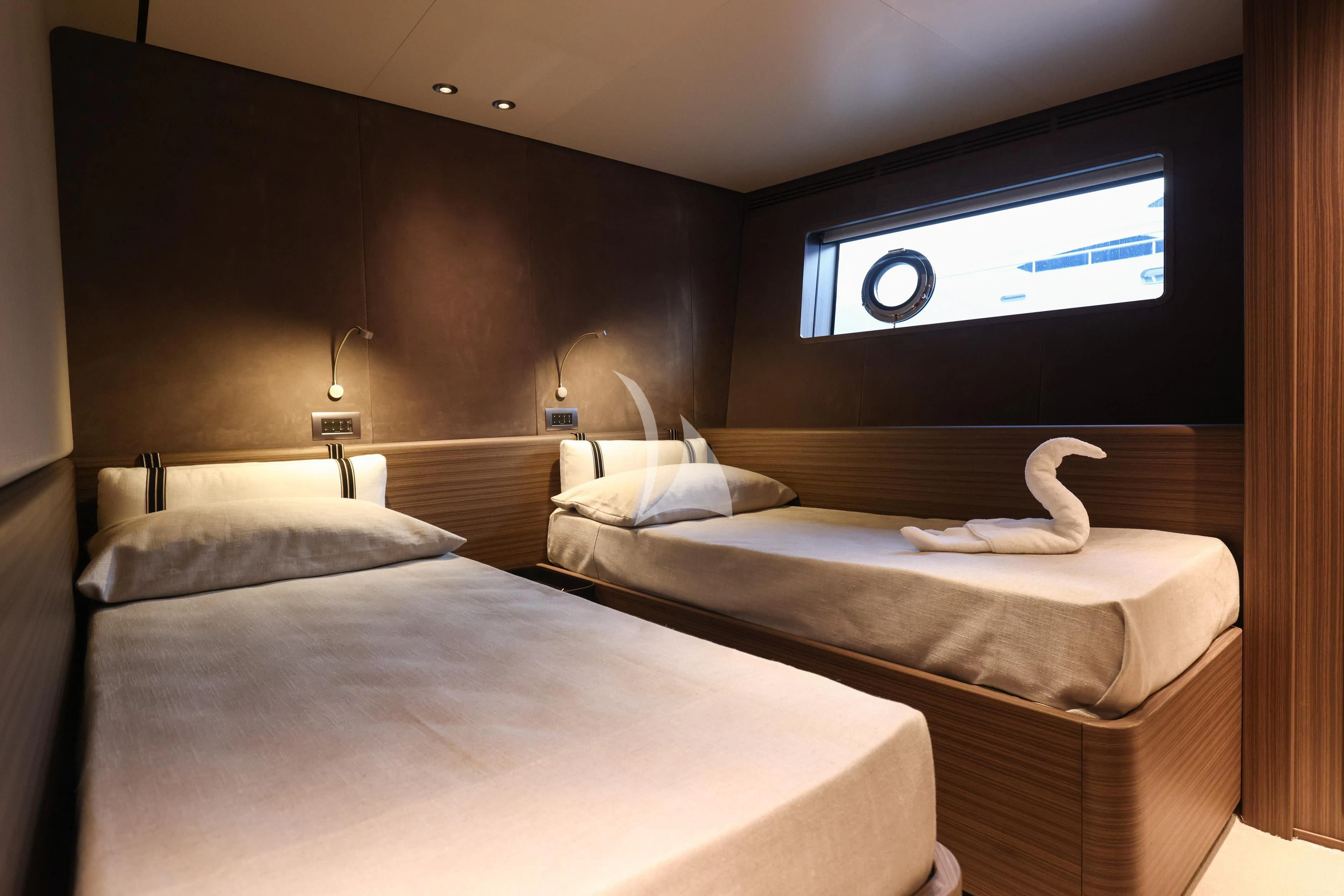 a hotel room with two beds aboard JYC Yacht for Sale