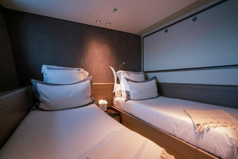 a couple of beds in a room aboard JYC Yacht for Sale