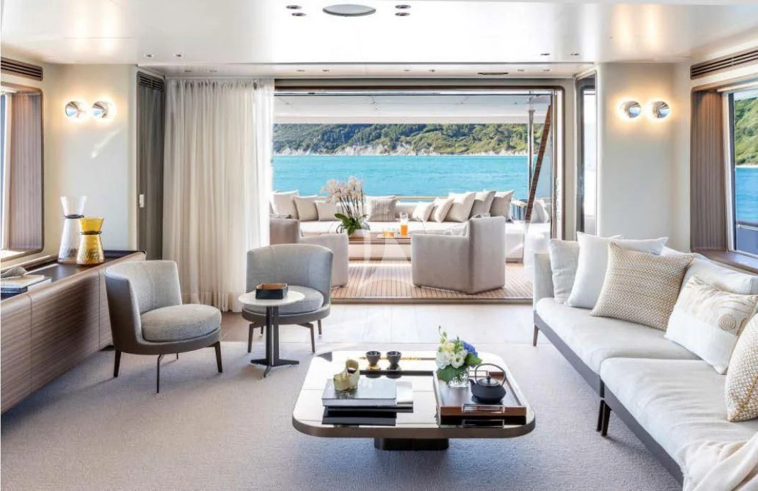 a living room with a large window aboard JYC Yacht for Sale