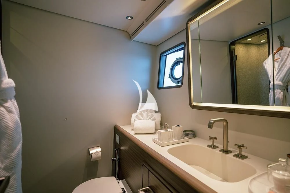 a bathroom with a large mirror aboard JYC Yacht for Sale