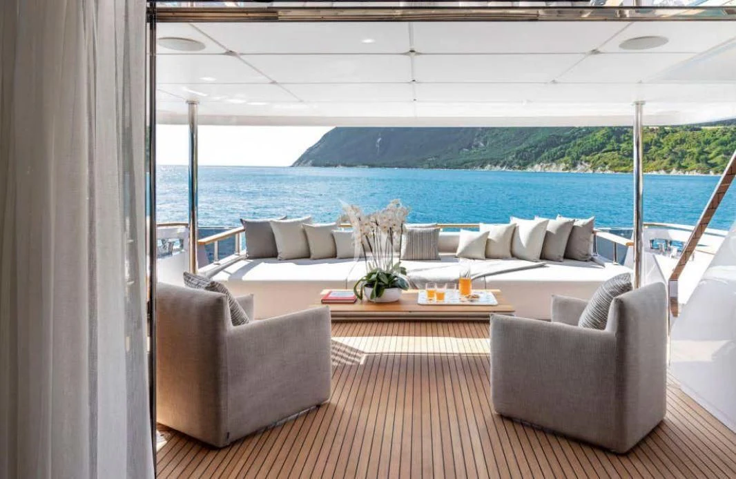 a living room with a large body of water aboard JYC Yacht for Sale