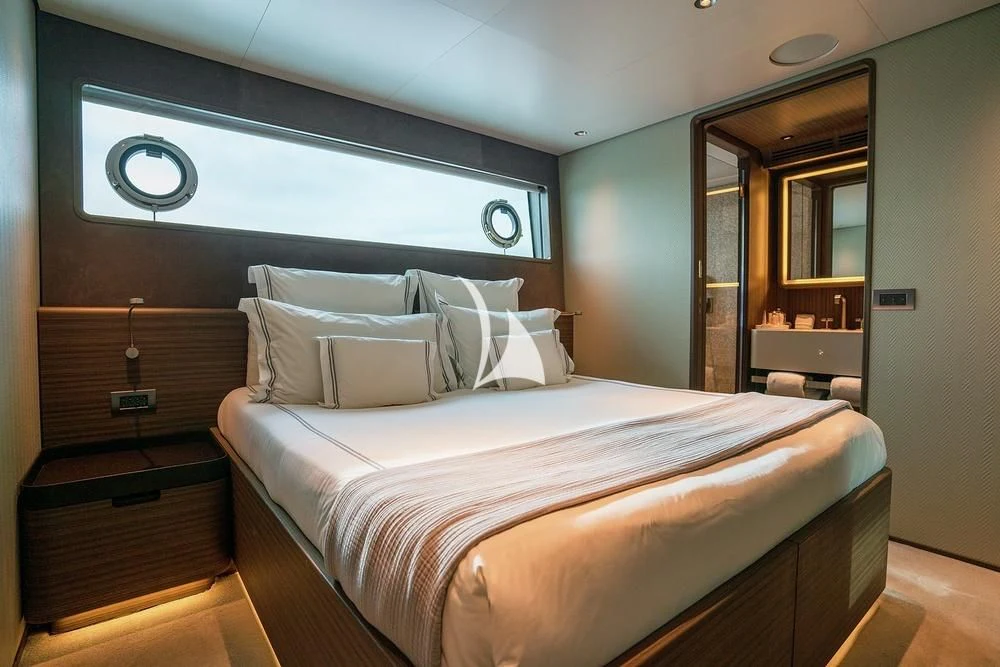 a bed in a room aboard JYC Yacht for Sale