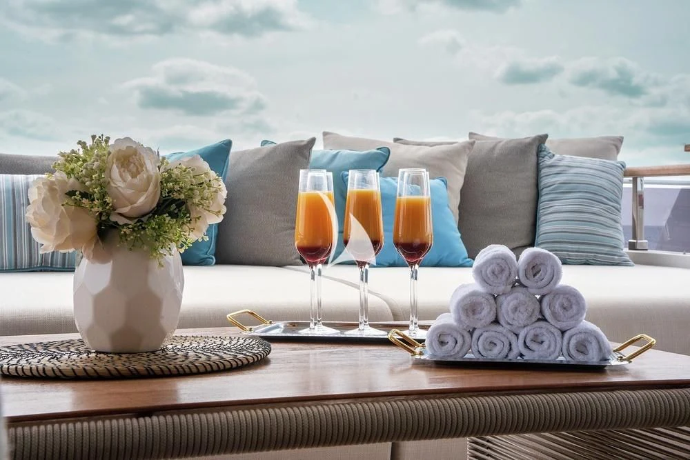 a table with food and drinks aboard JYC Yacht for Sale