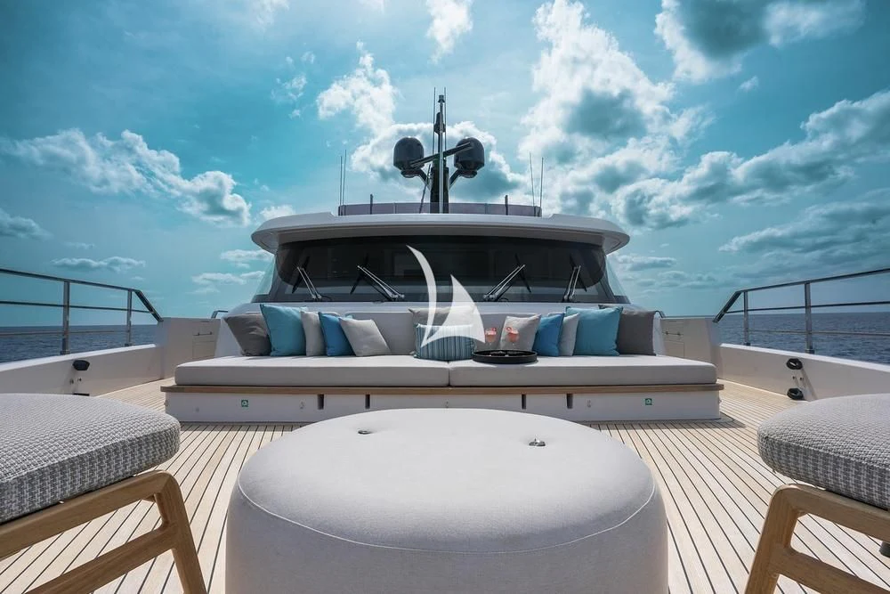a large white boat on a deck aboard JYC Yacht for Sale