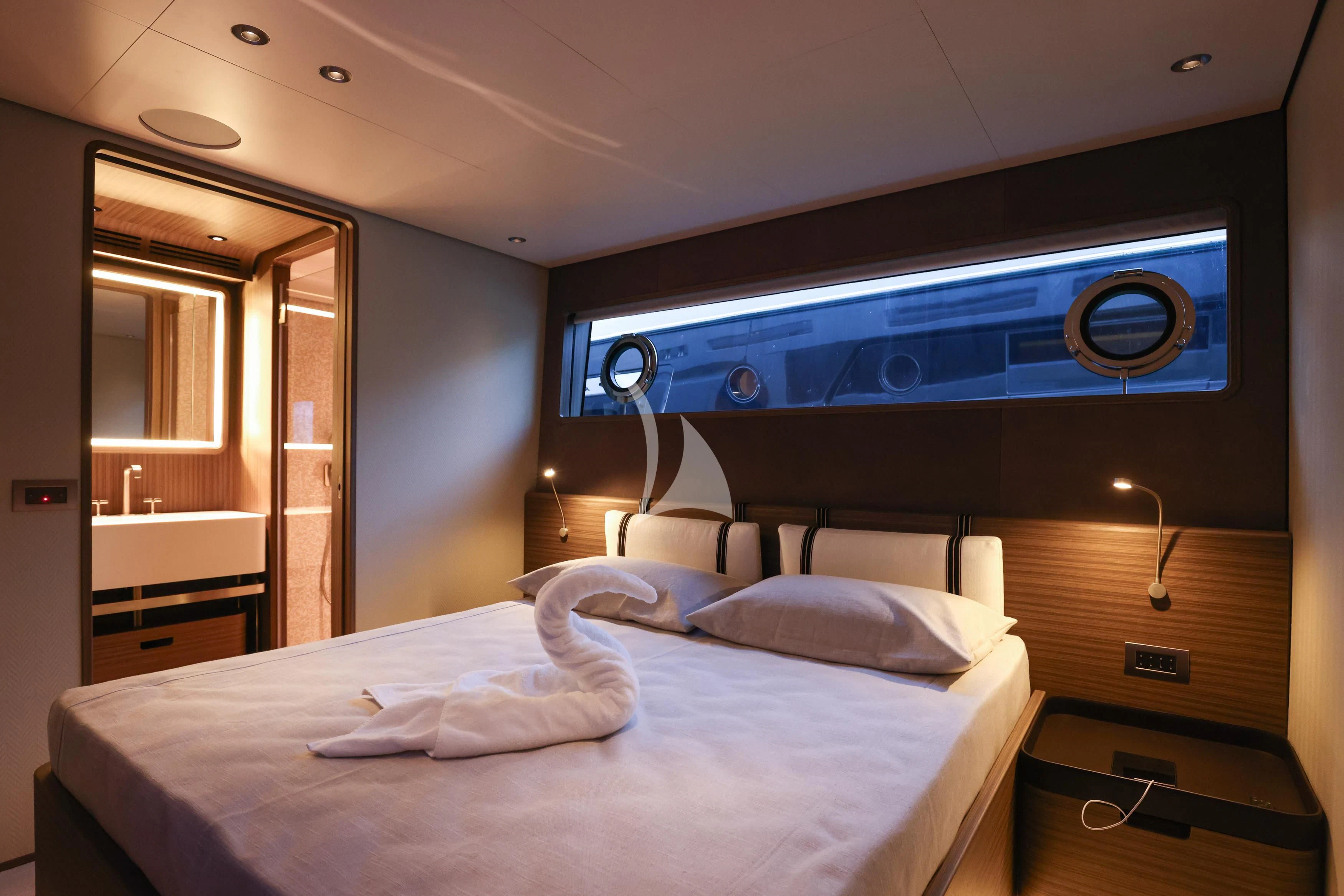 a hotel room with a bed aboard JYC Yacht for Sale