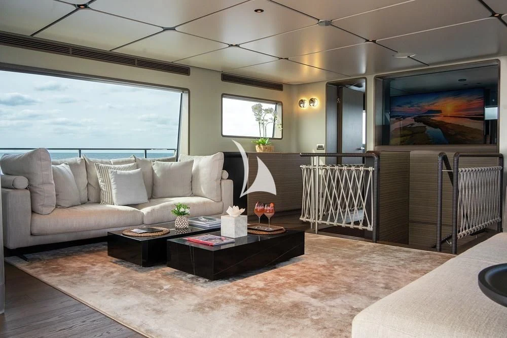 a living room with a large window aboard JYC Yacht for Sale