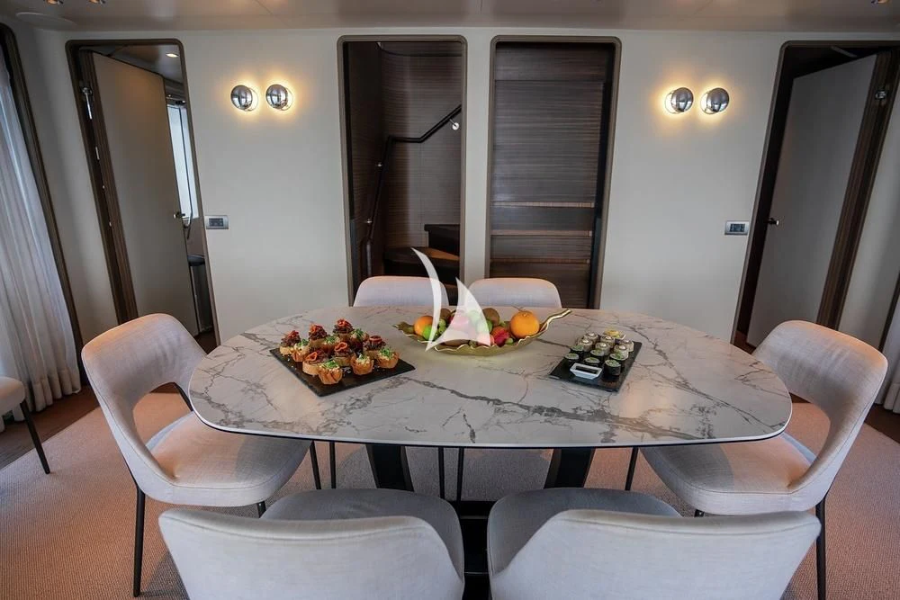 a table with food on it aboard JYC Yacht for Sale