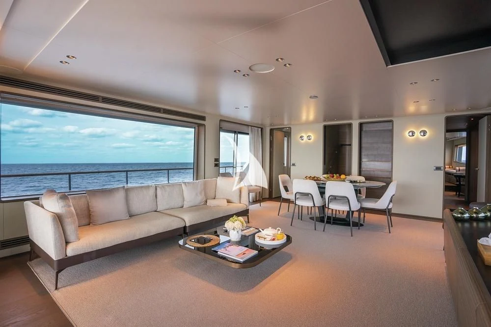 a living room with a large window aboard JYC Yacht for Sale