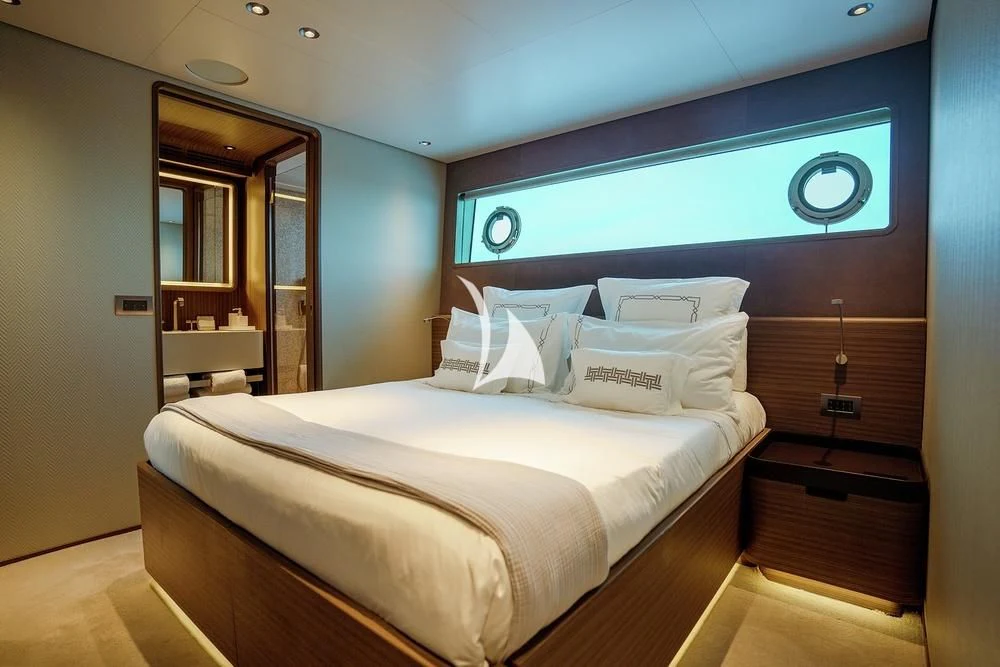 a bed in a room aboard JYC Yacht for Sale