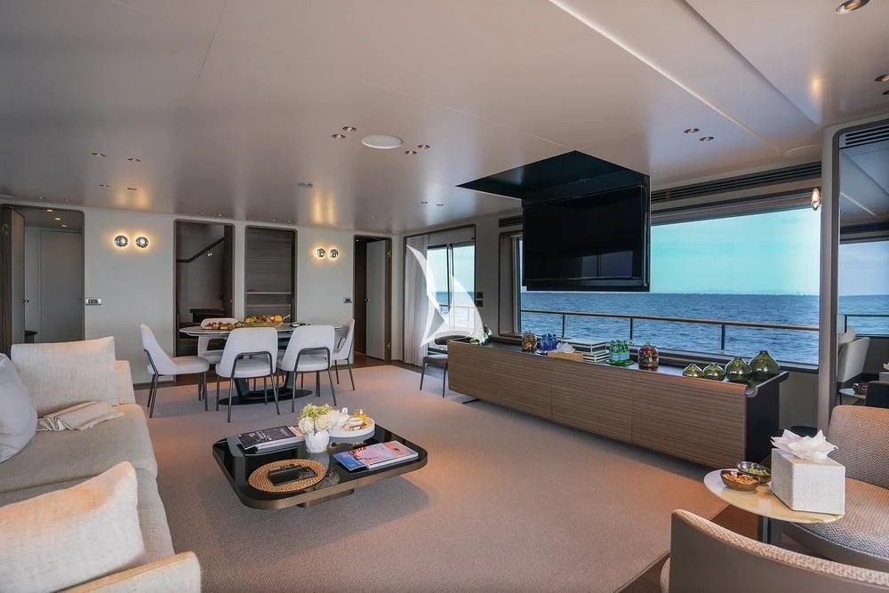 a living room with a large window aboard JYC Yacht for Sale