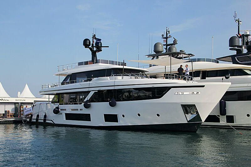 a large white boat with a helicopter on top aboard JYC Yacht for Sale