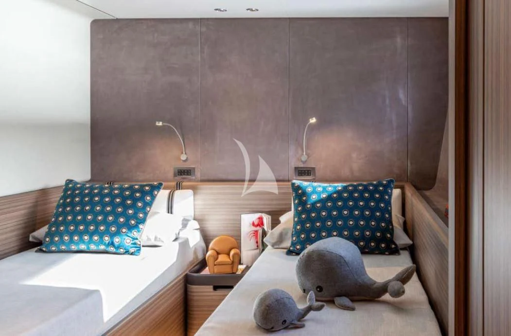 a cat lying on a table aboard JYC Yacht for Sale