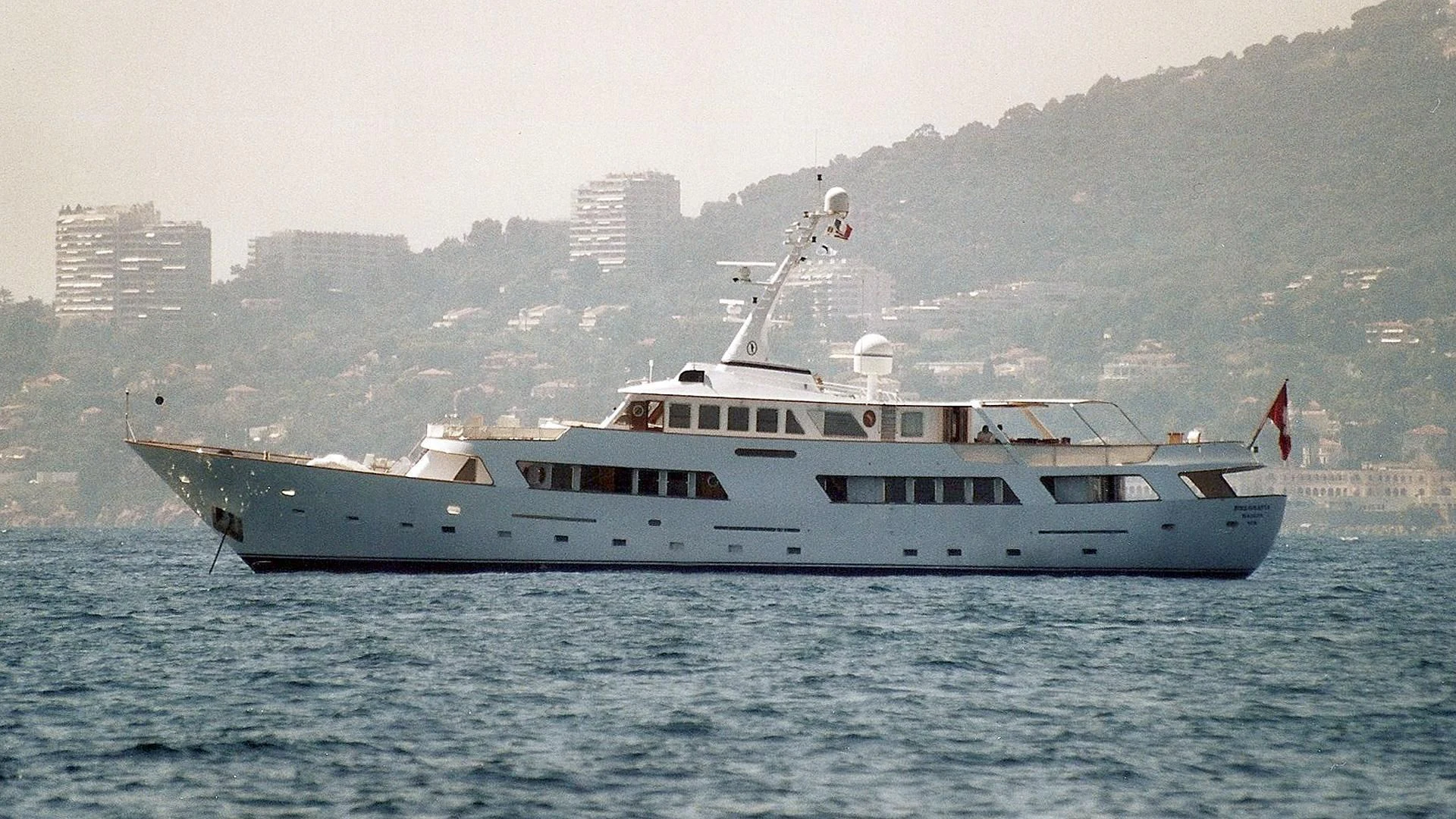 a large white boat in the water aboard MONTECRISTO Yacht for Sale