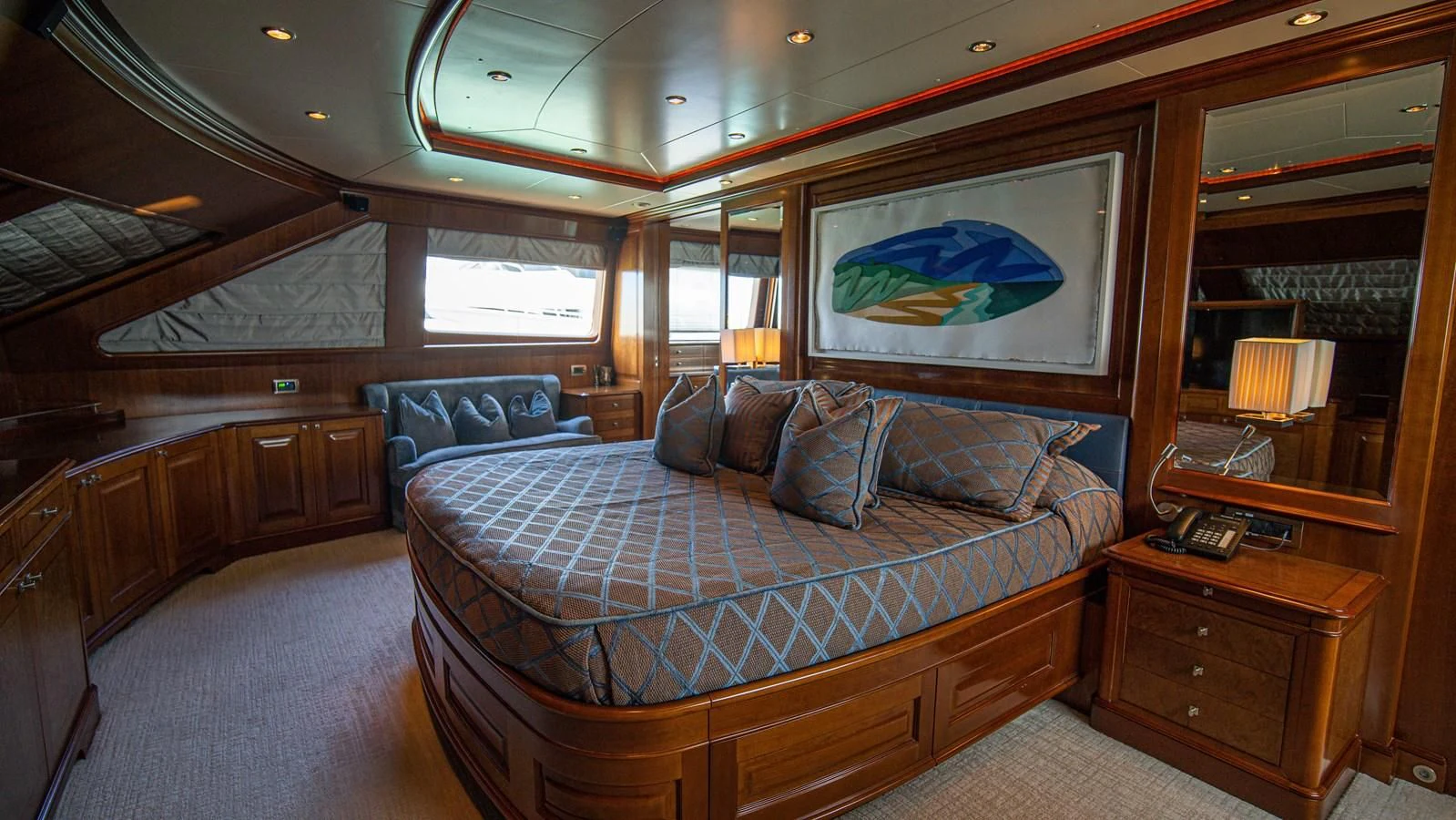 a bedroom with a bed and a dresser aboard ORINOKIA Yacht for Sale