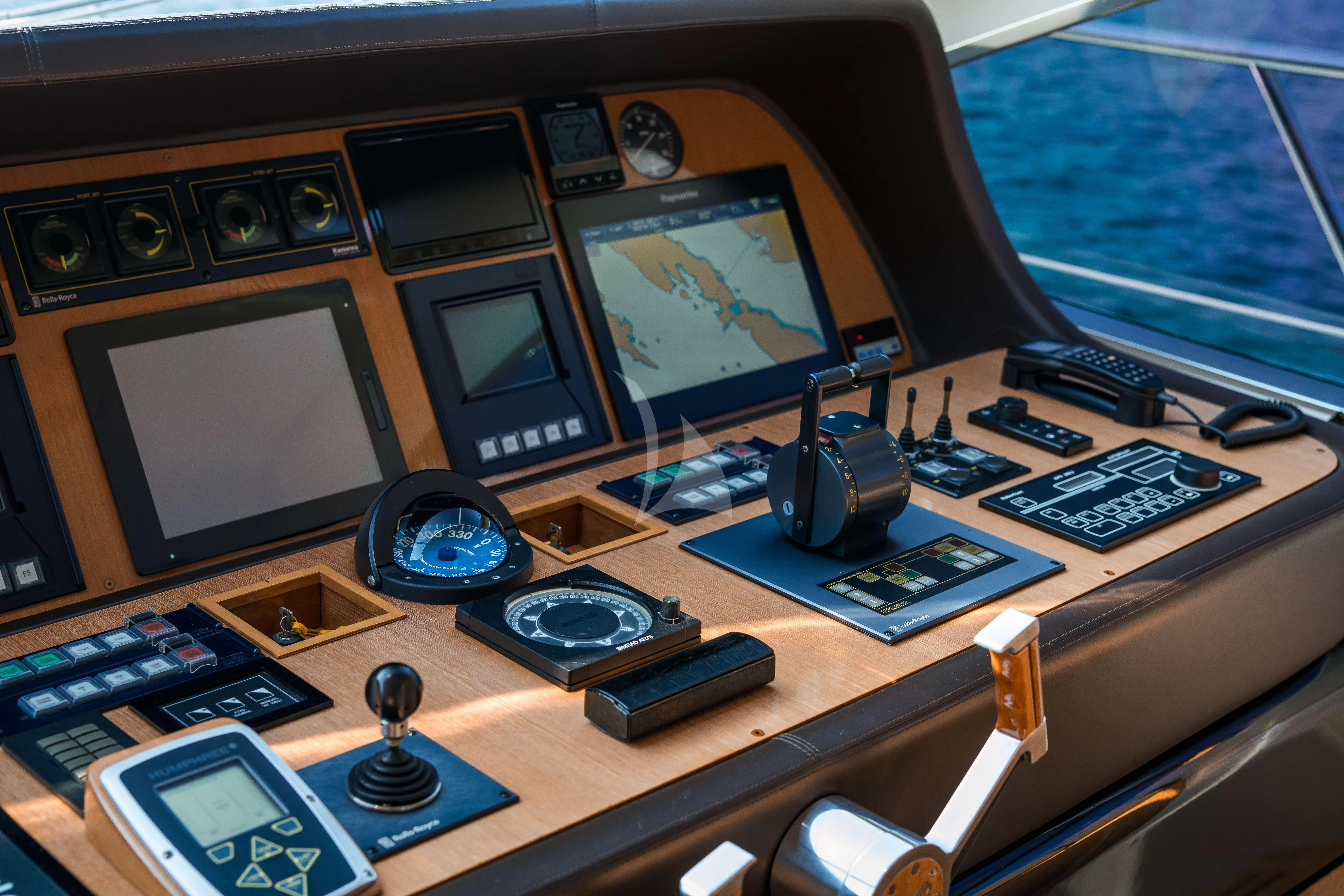 a desk with a computer and other electronics on it aboard TOBEKA Yacht for Sale