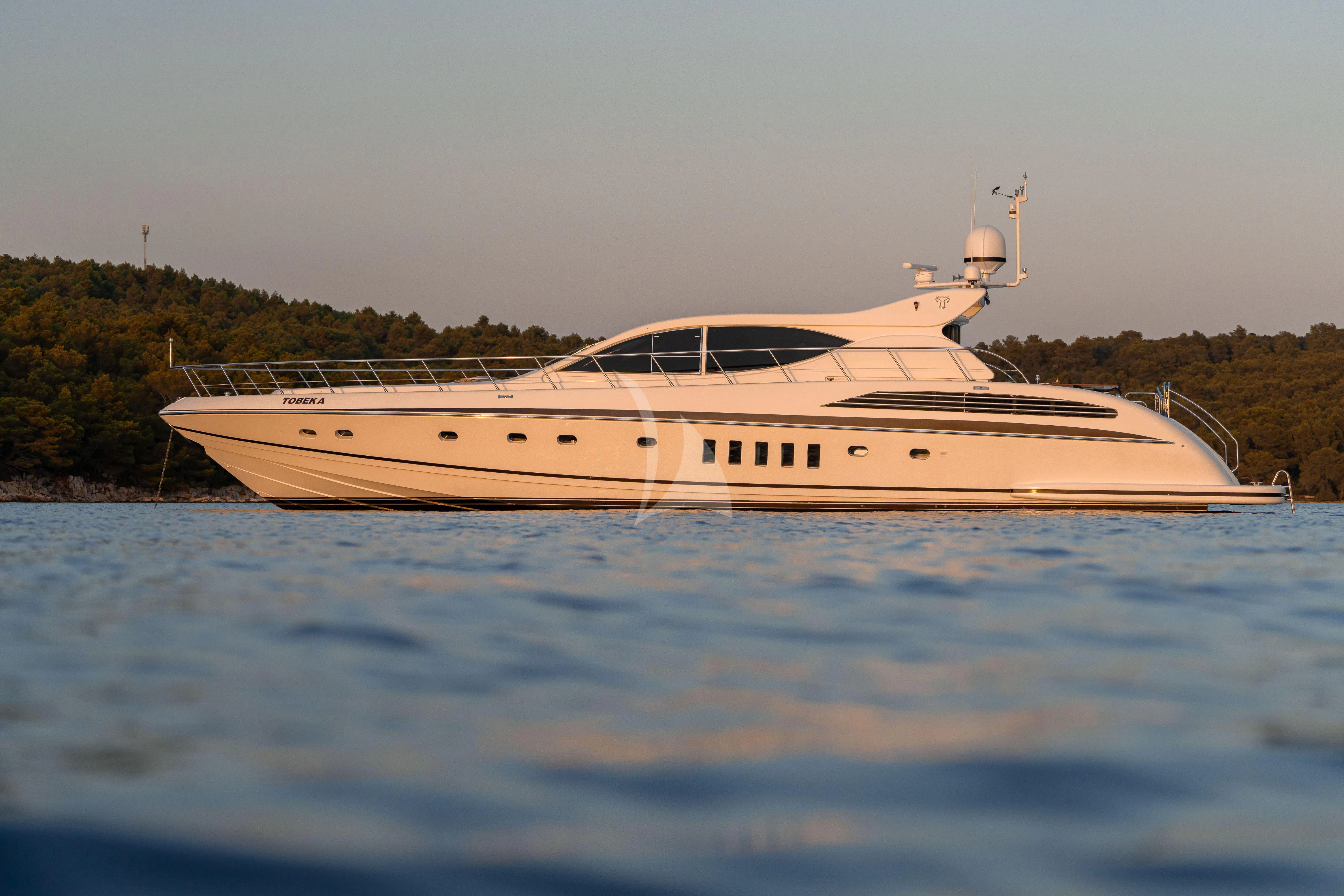 a white yacht in the water aboard TOBEKA Yacht for Sale