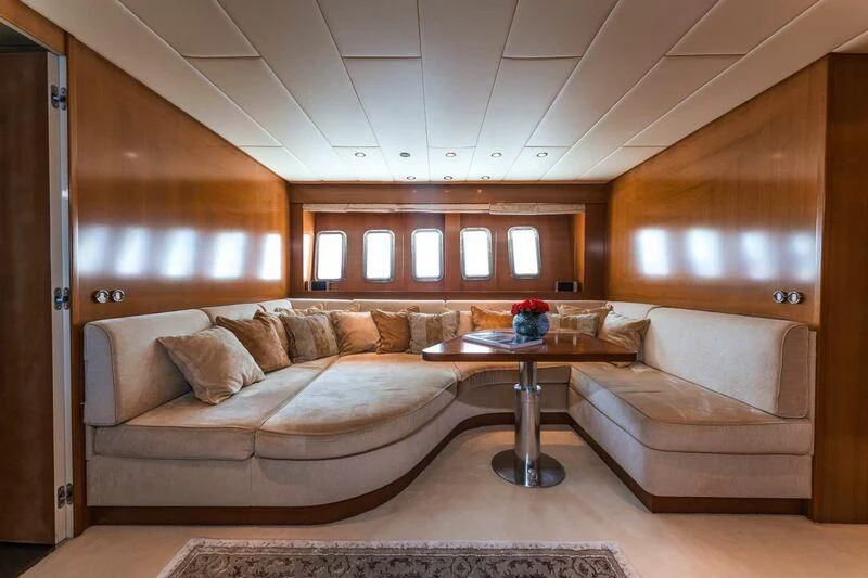 a living room with a couch and a coffee table aboard TOBEKA Yacht for Sale