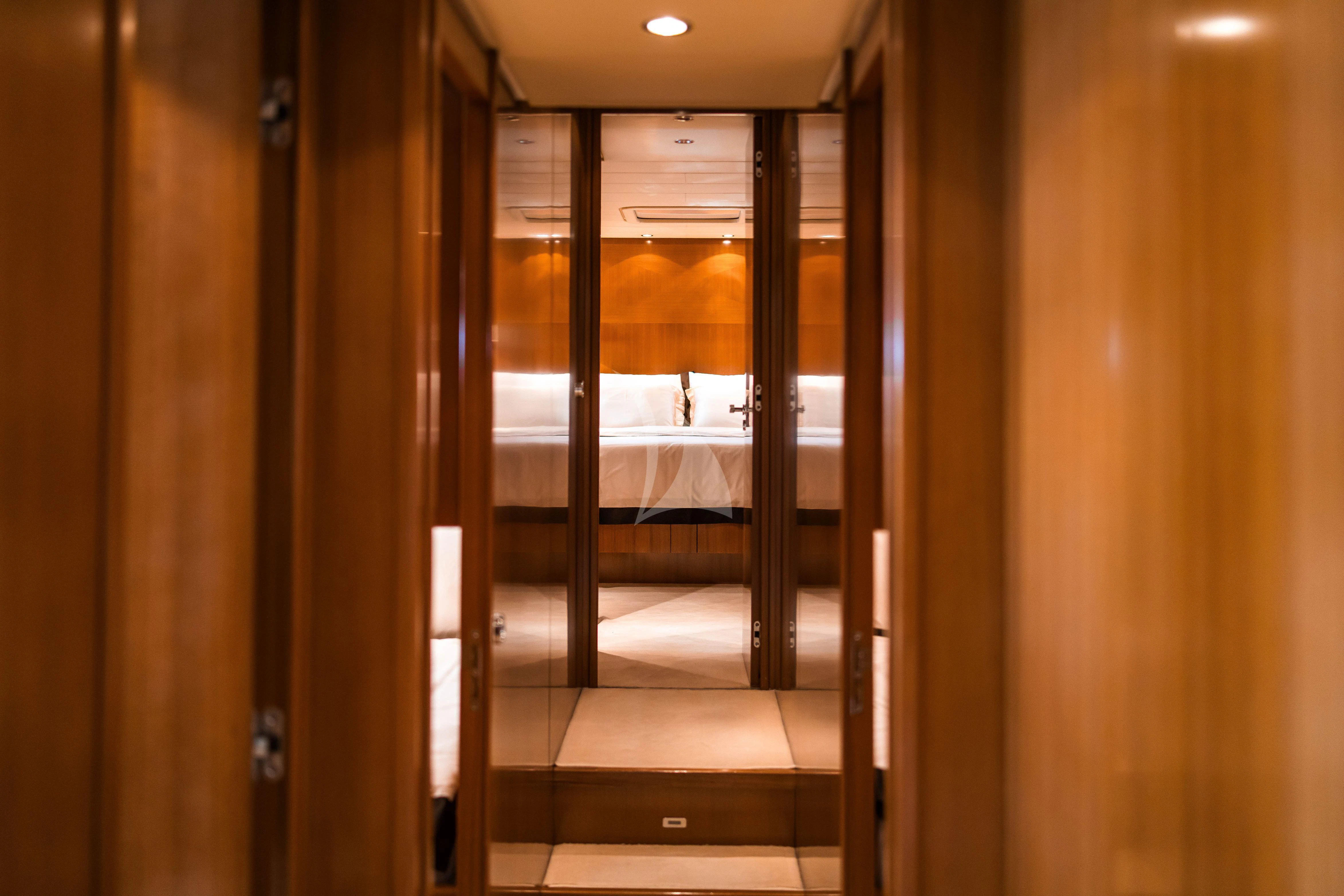 a hallway with glass doors aboard TOBEKA Yacht for Sale