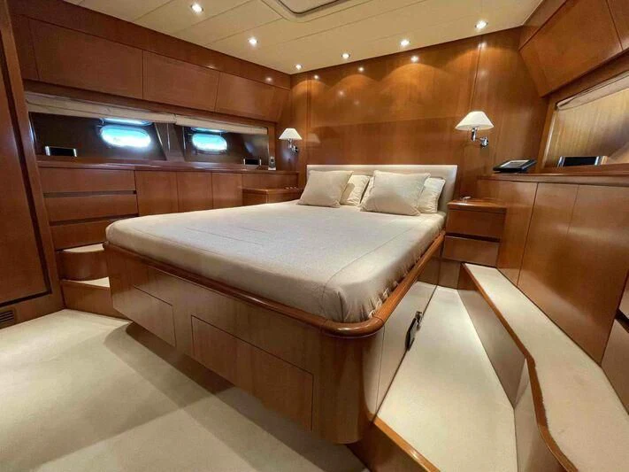 a room with a bed and a desk aboard TOBEKA Yacht for Sale