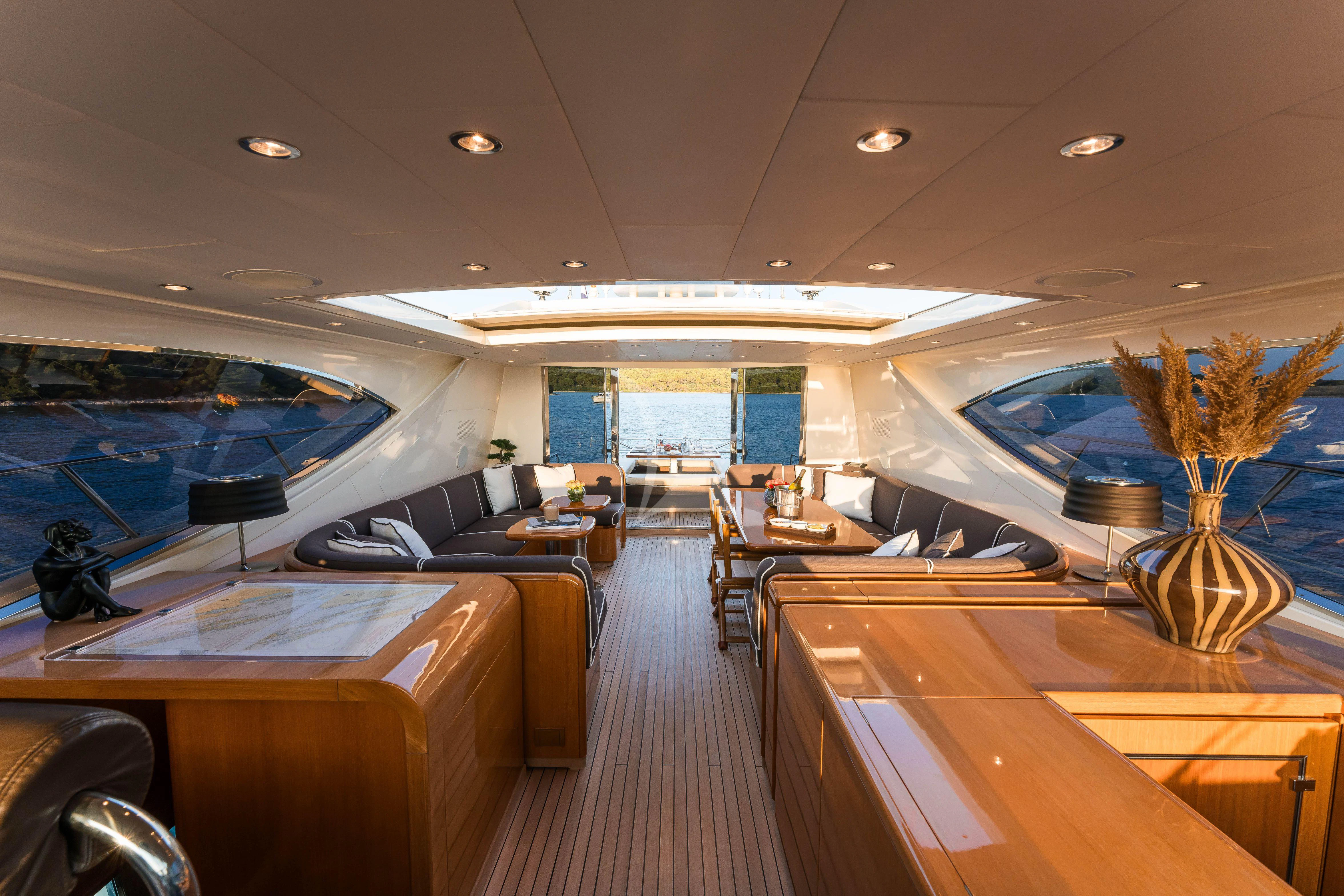 a room with a large desk and chairs and a large window aboard TOBEKA Yacht for Sale