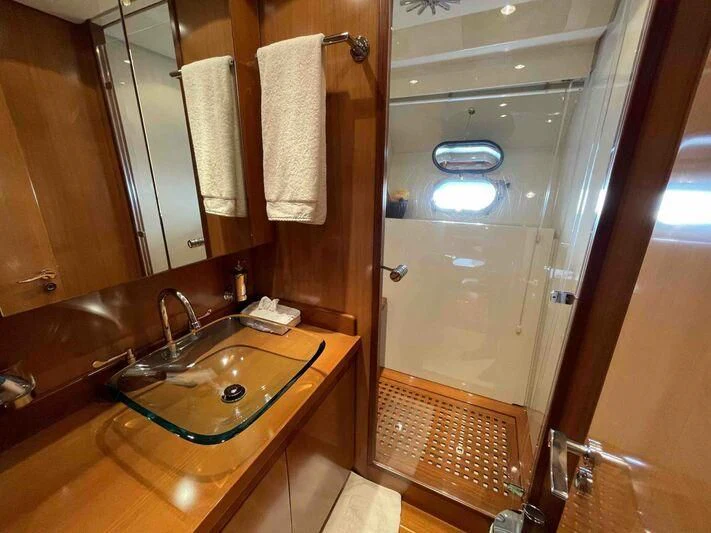 a bathroom with a sink and a shower aboard TOBEKA Yacht for Sale