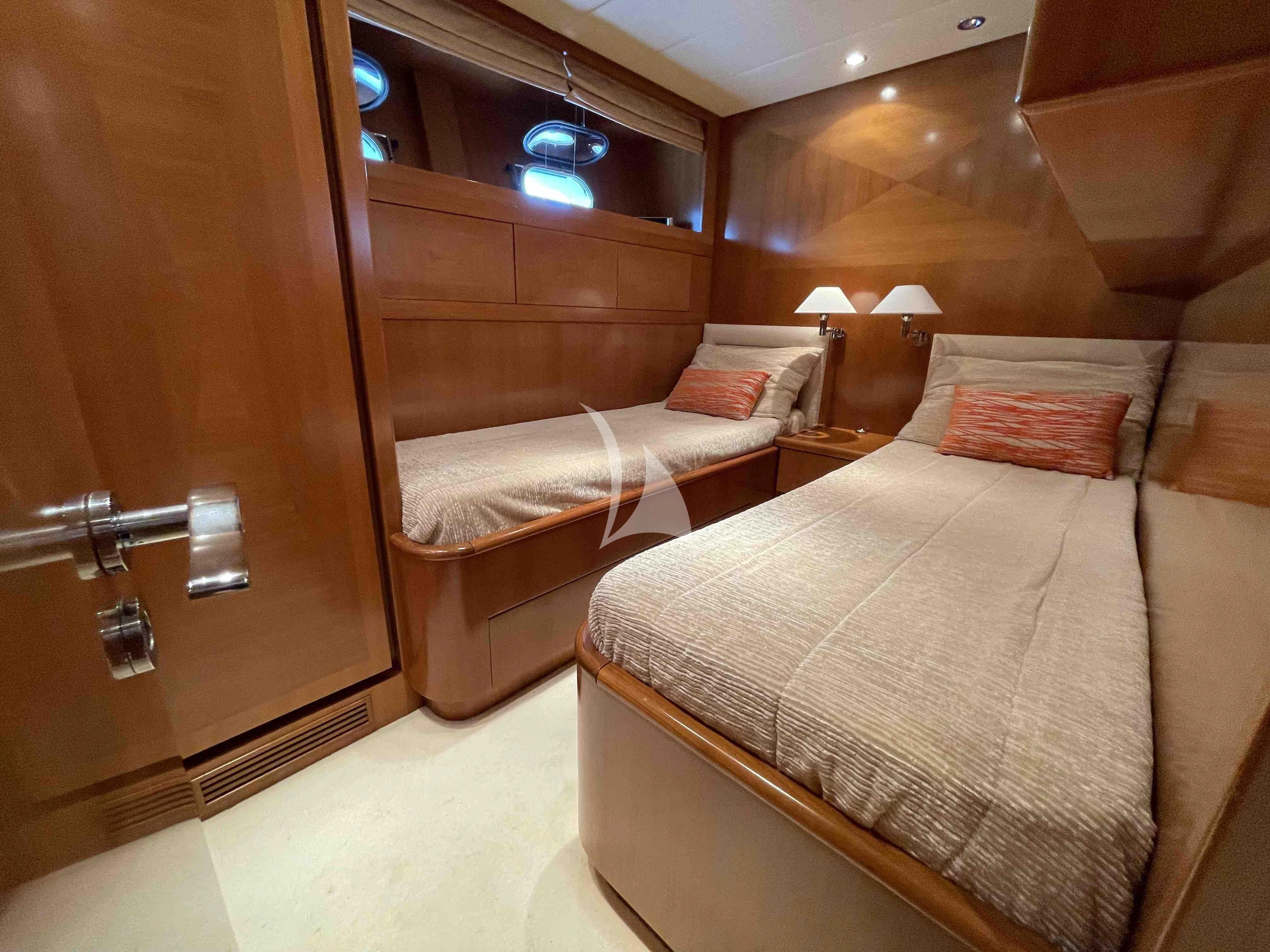 a room with two beds aboard TOBEKA Yacht for Sale