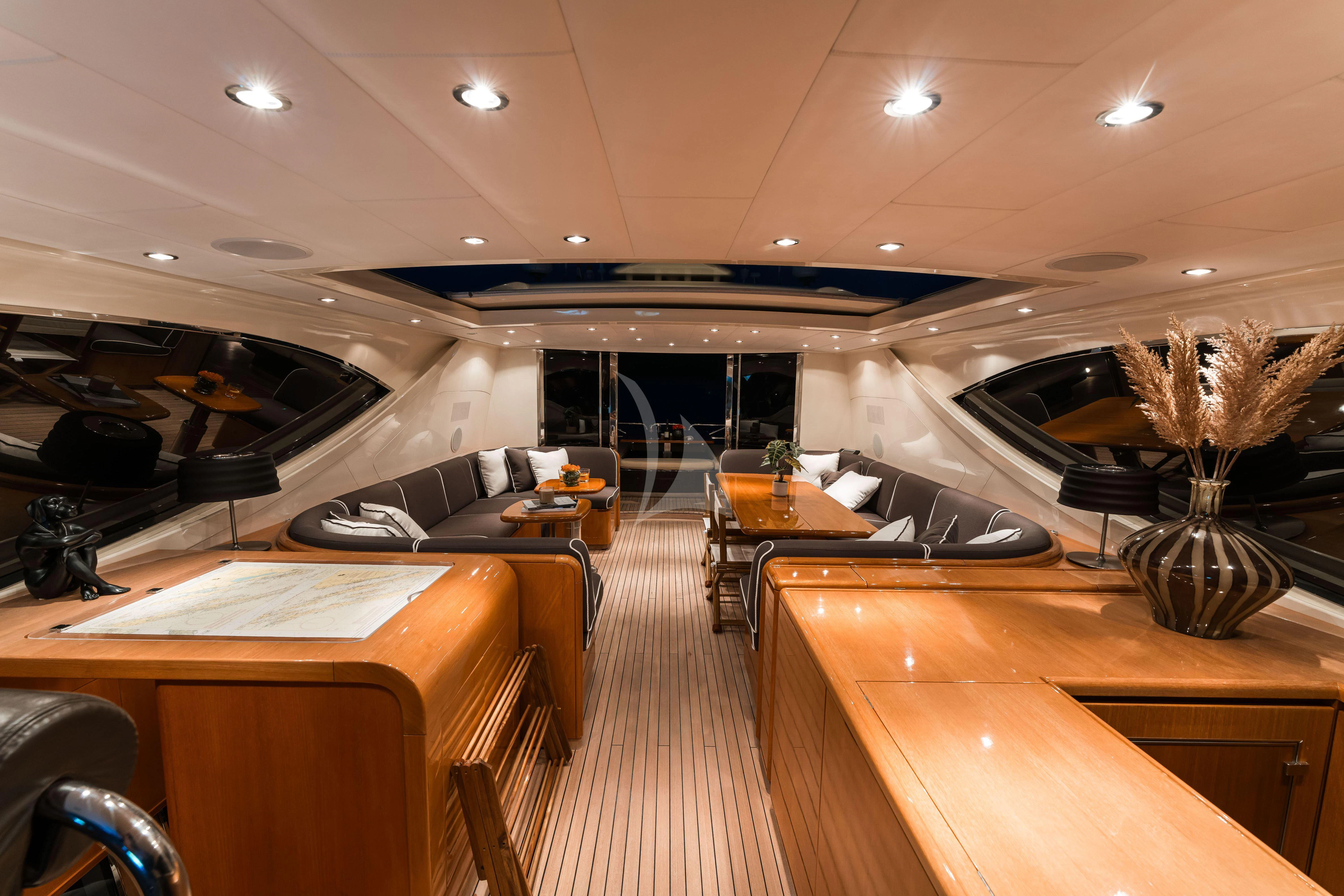 a room with a couch and a table with chairs aboard TOBEKA Yacht for Sale