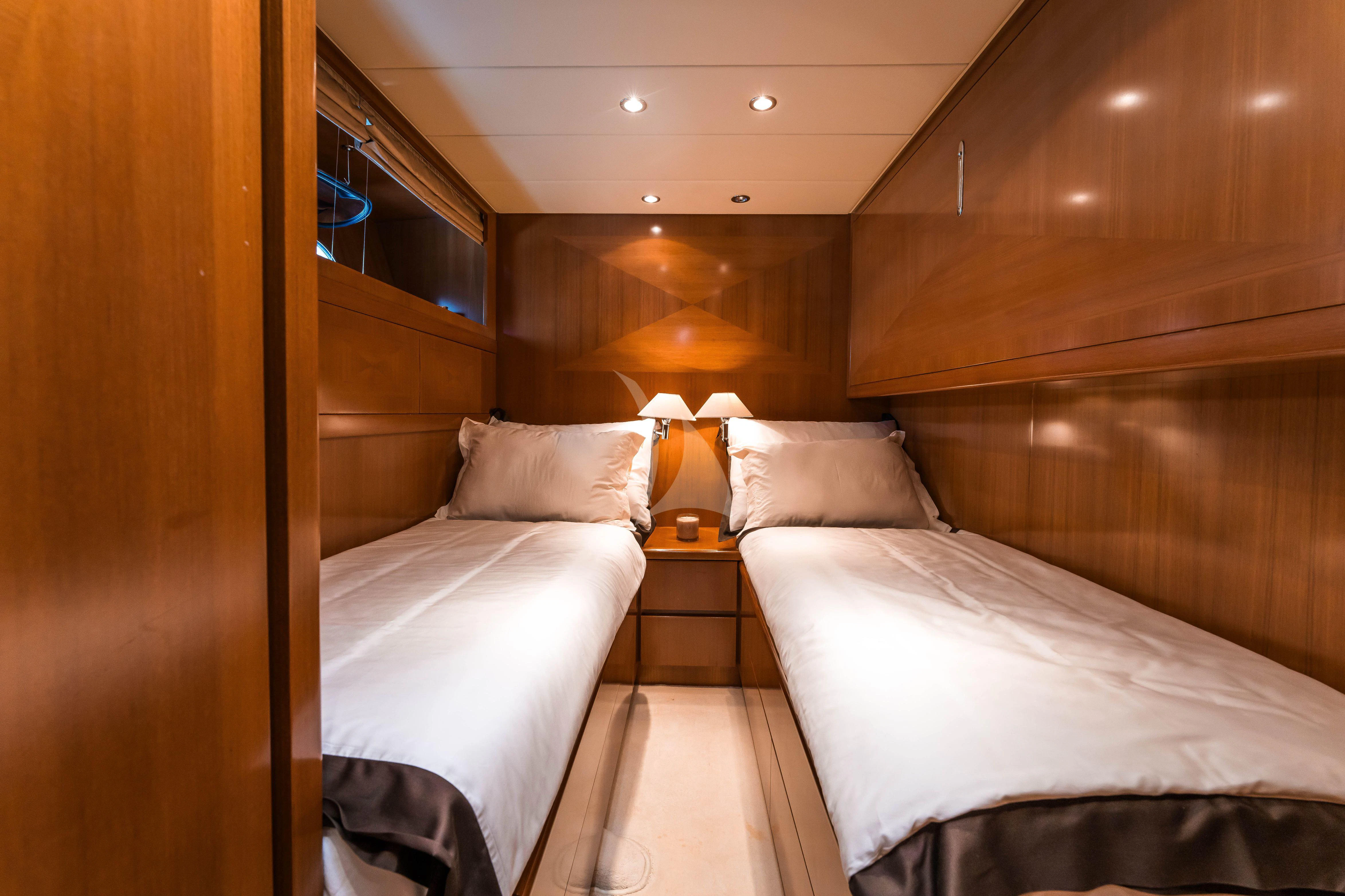 a room with two beds aboard TOBEKA Yacht for Sale