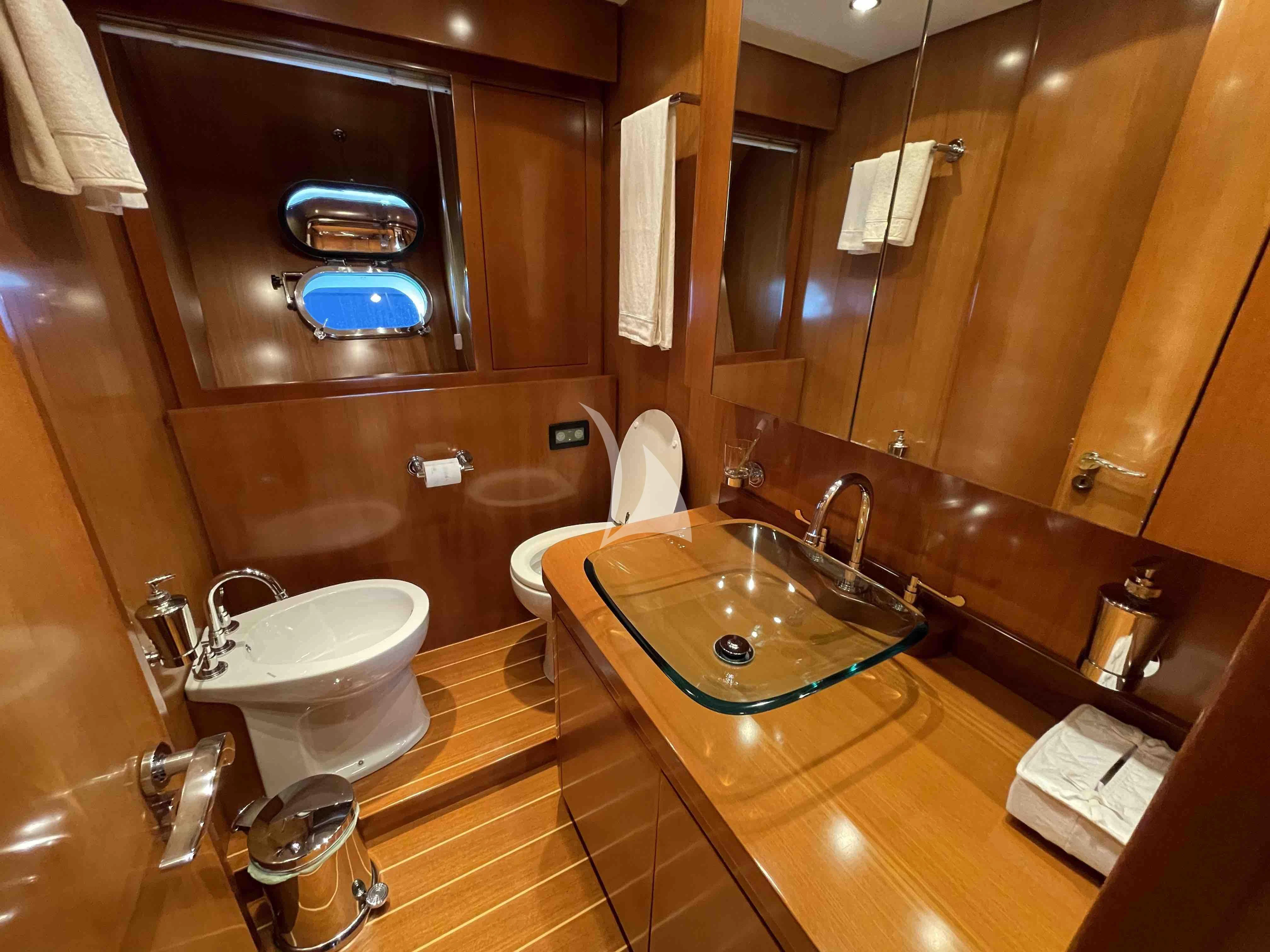 a bathroom with a large mirror aboard TOBEKA Yacht for Sale