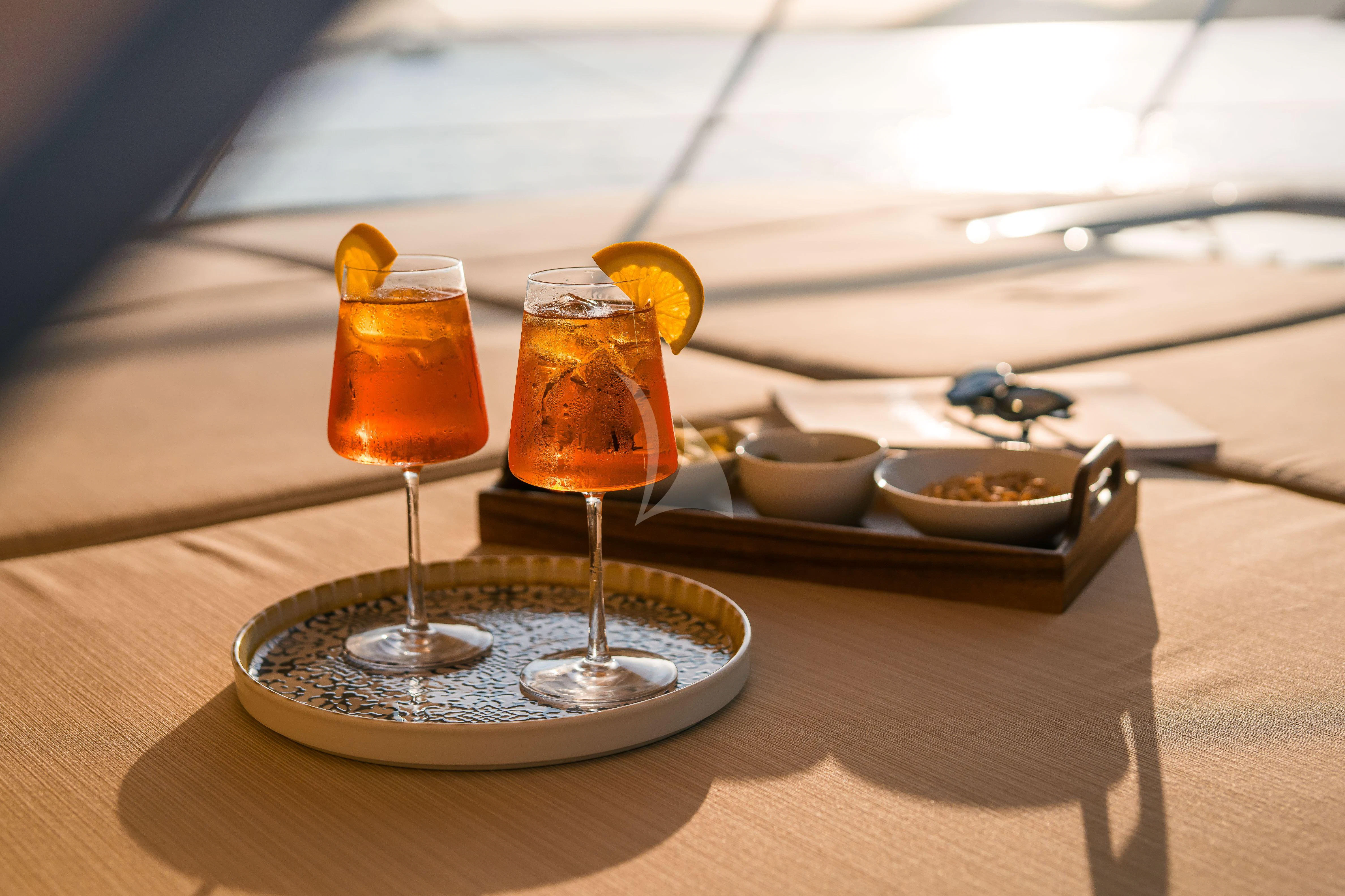 a couple of glasses with liquid in them aboard TOBEKA Yacht for Sale
