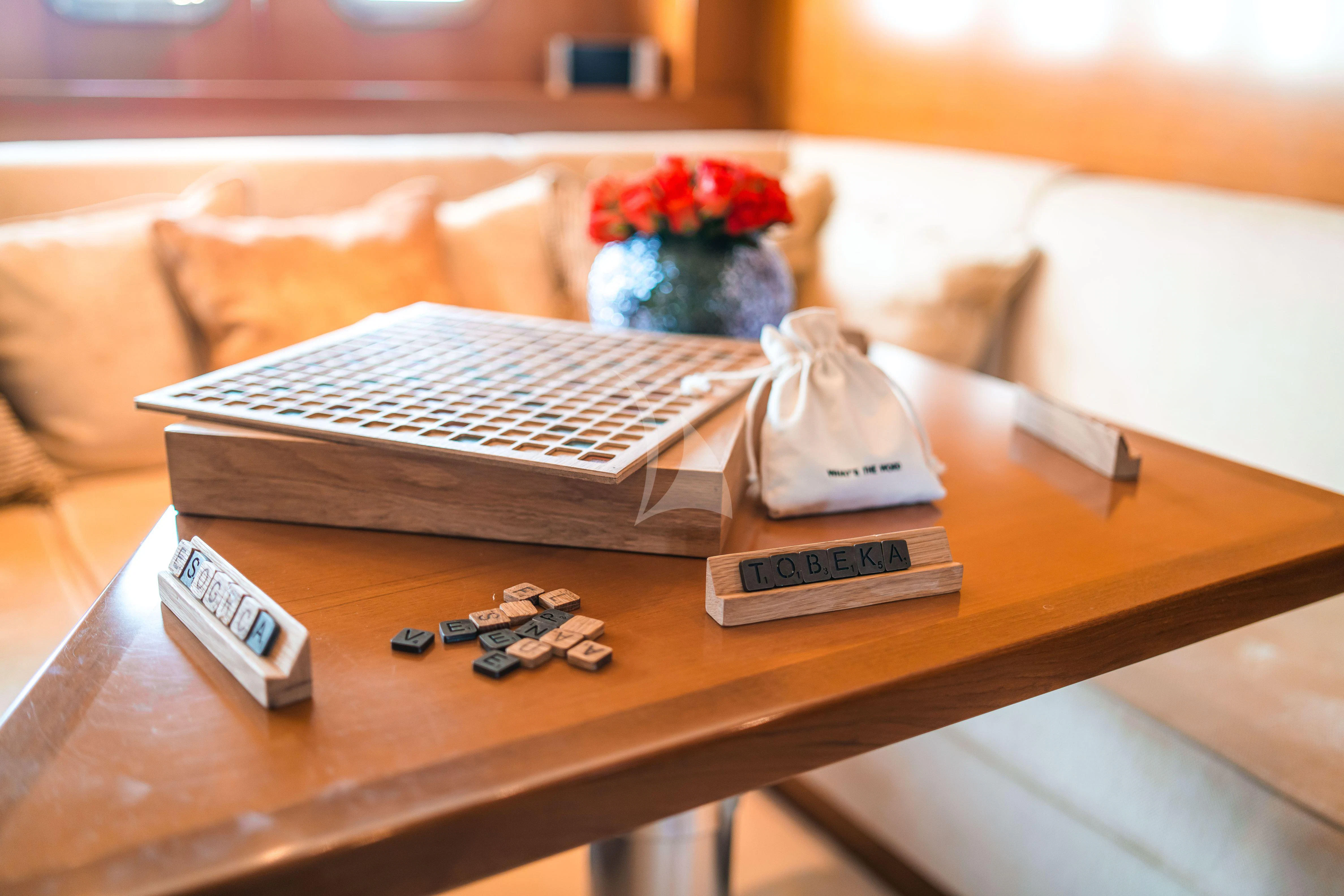 a desk with a keyboard and remote controls aboard TOBEKA Yacht for Sale