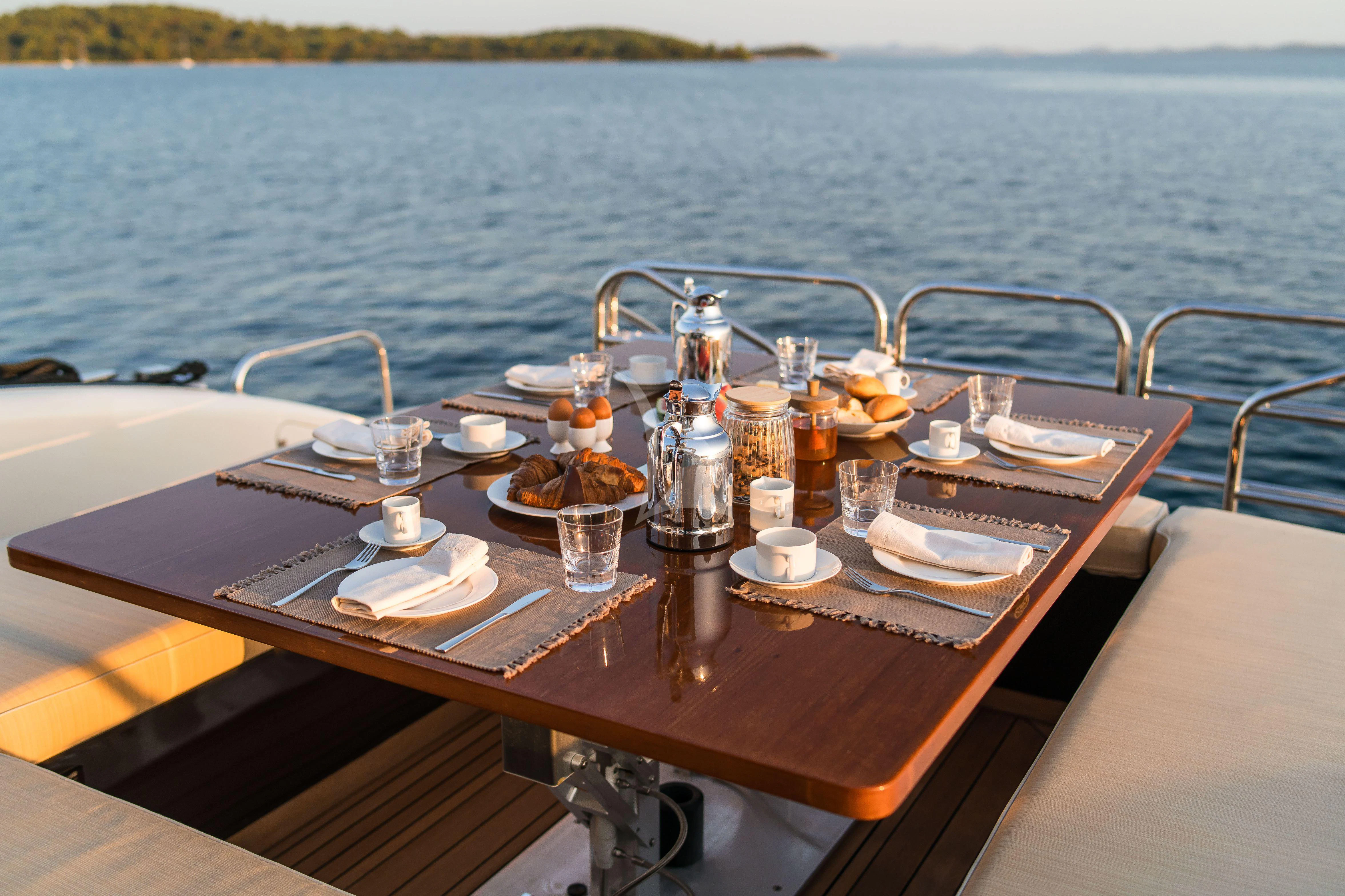 a table with food on it aboard TOBEKA Yacht for Sale