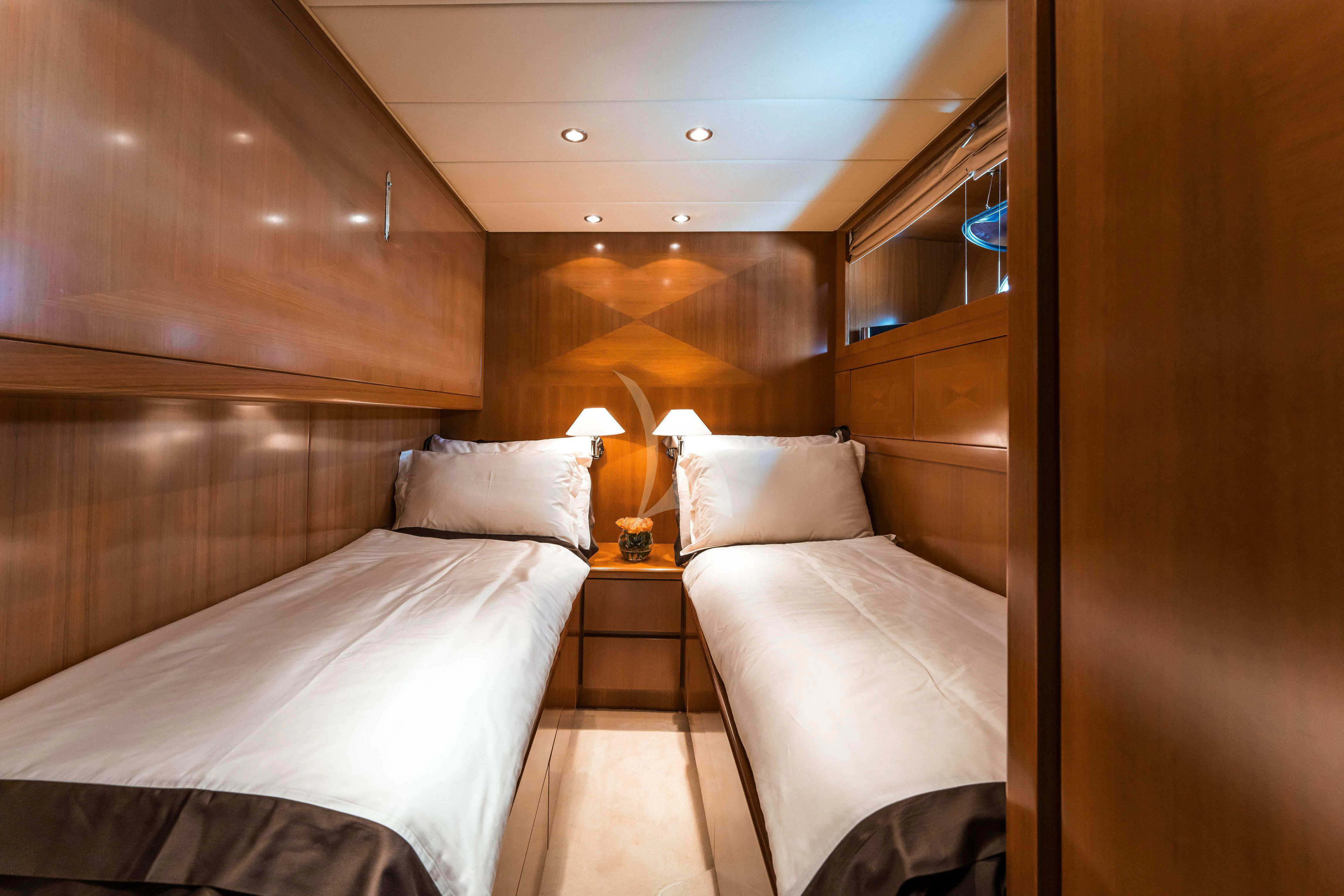 a room with two beds aboard TOBEKA Yacht for Sale