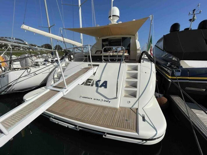 a boat docked at a pier aboard TOBEKA Yacht for Sale