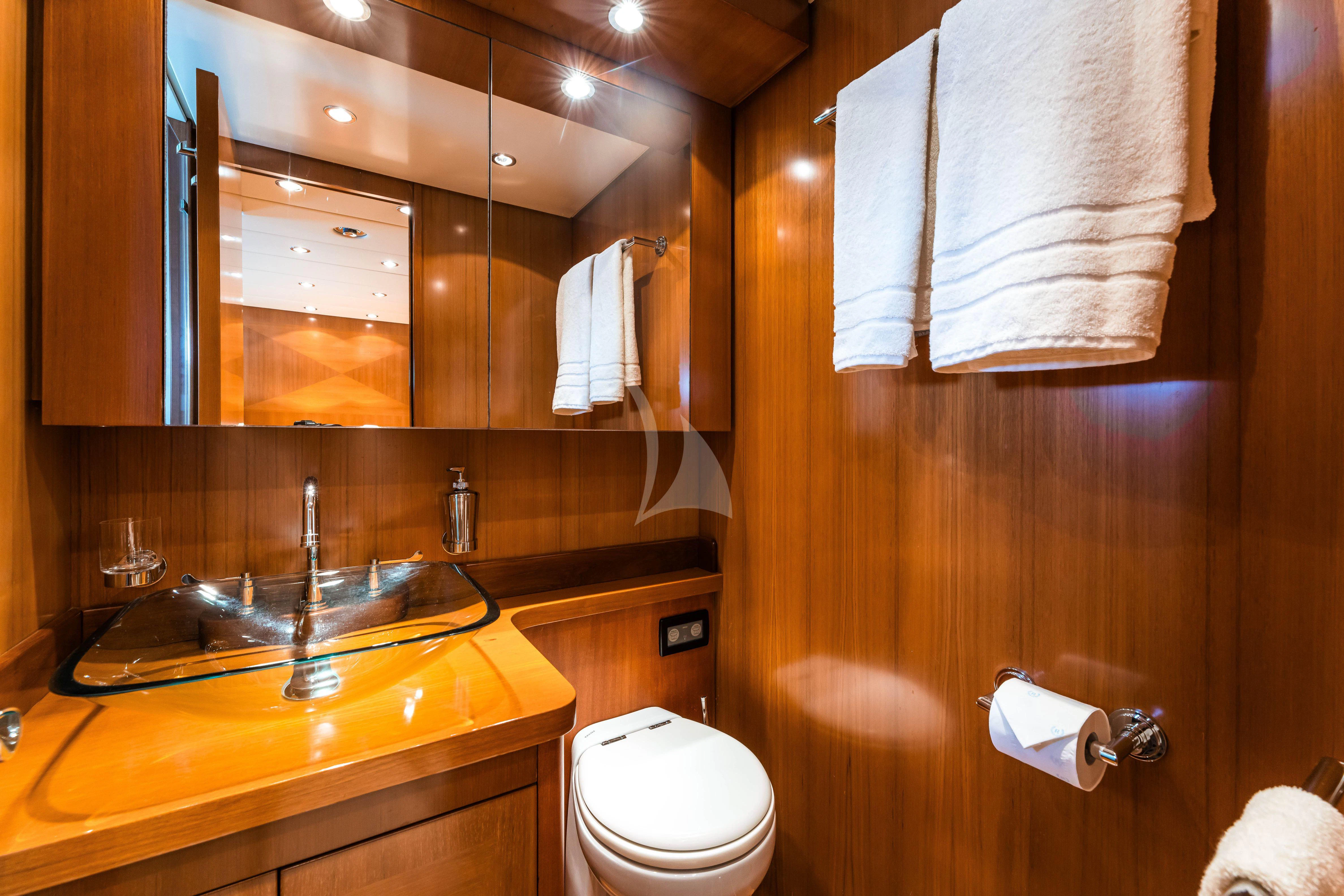 a bathroom with a sink and toilet aboard TOBEKA Yacht for Sale
