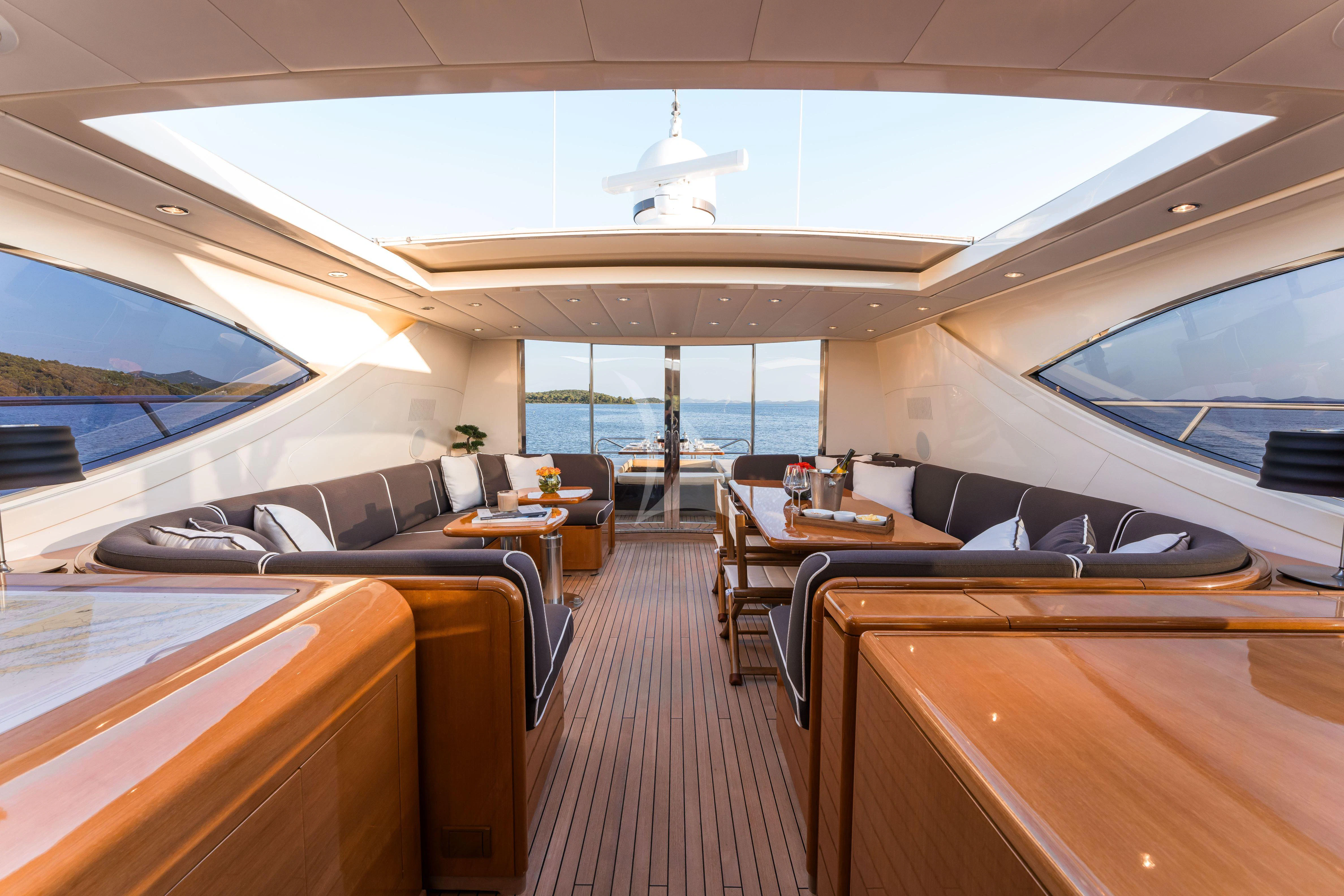 a boat with a large deck aboard TOBEKA Yacht for Sale