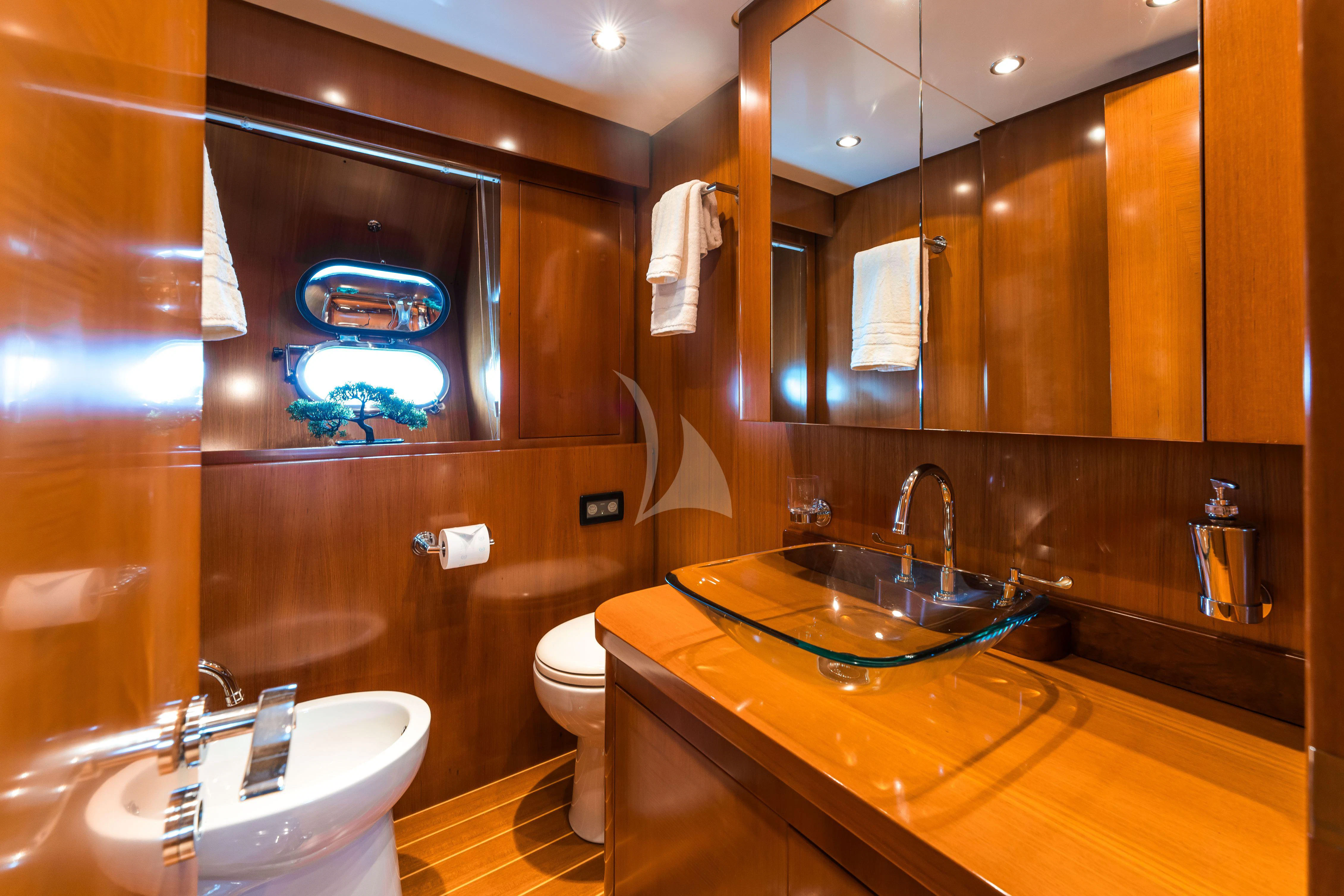 a bathroom with a large mirror aboard TOBEKA Yacht for Sale