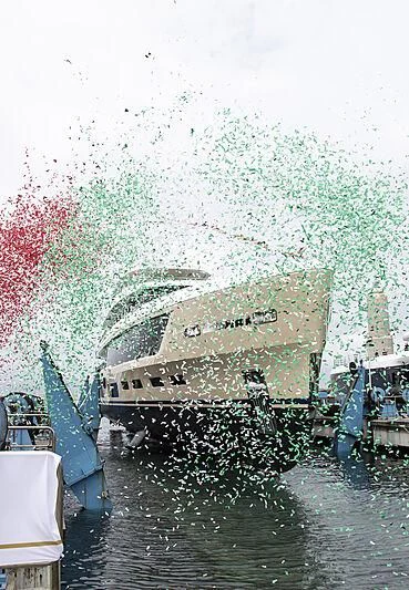 a group of boats in a body of water with a large group of birds flying around aboard HAWA Yacht for Sale