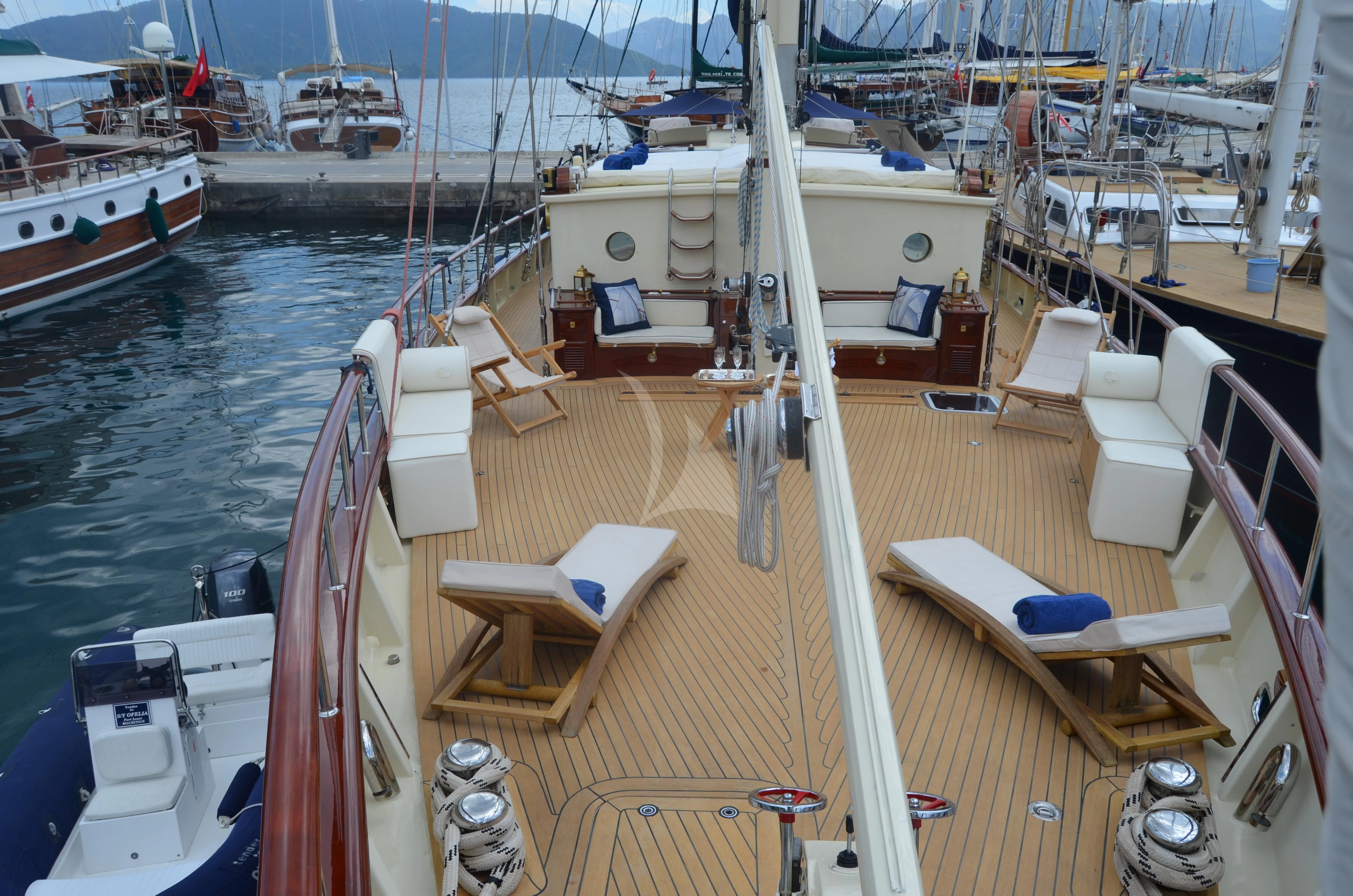 a boat dock with boats aboard OFELIA Yacht for Sale