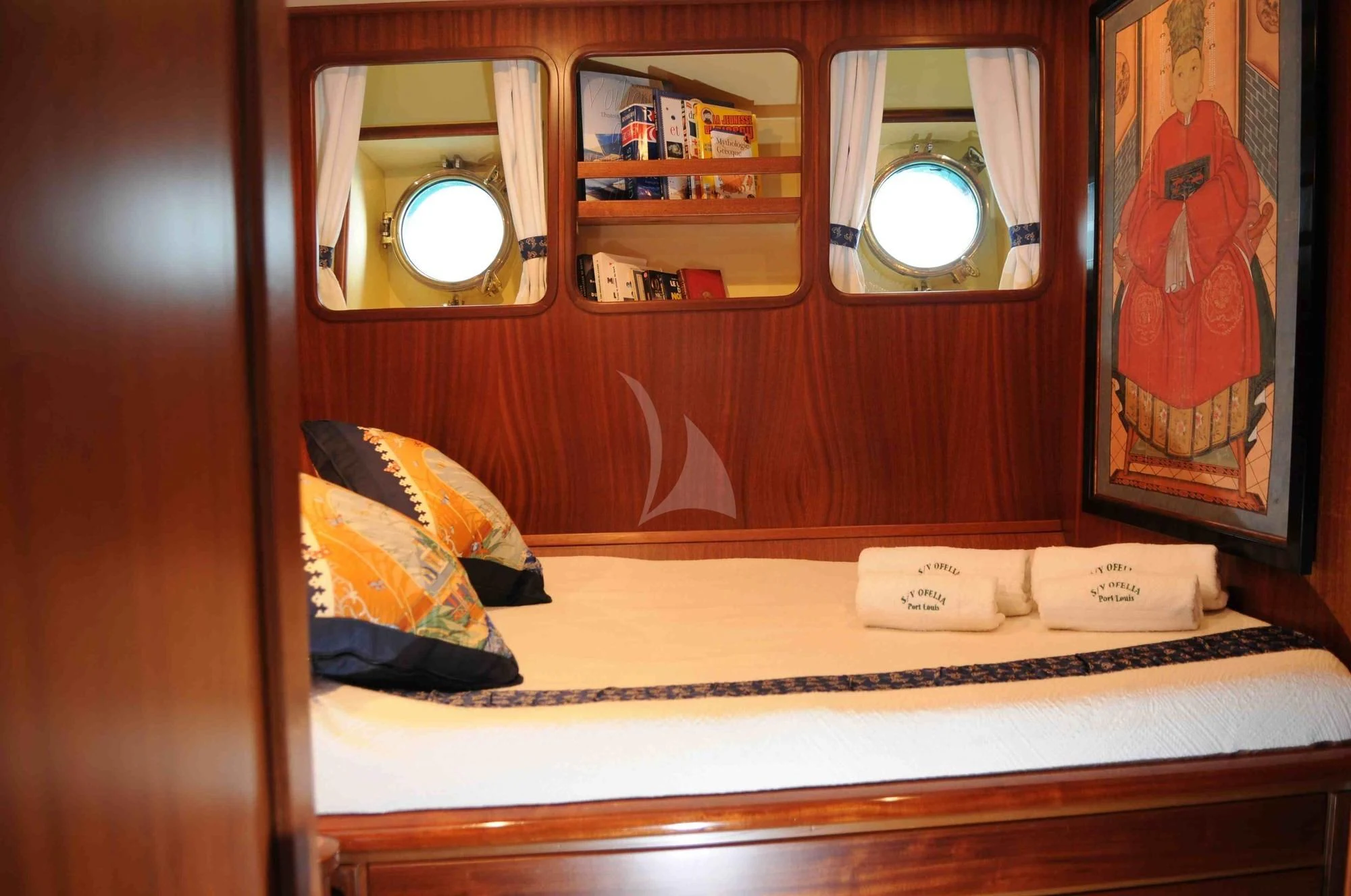 a mirror above a bed aboard OFELIA Yacht for Sale