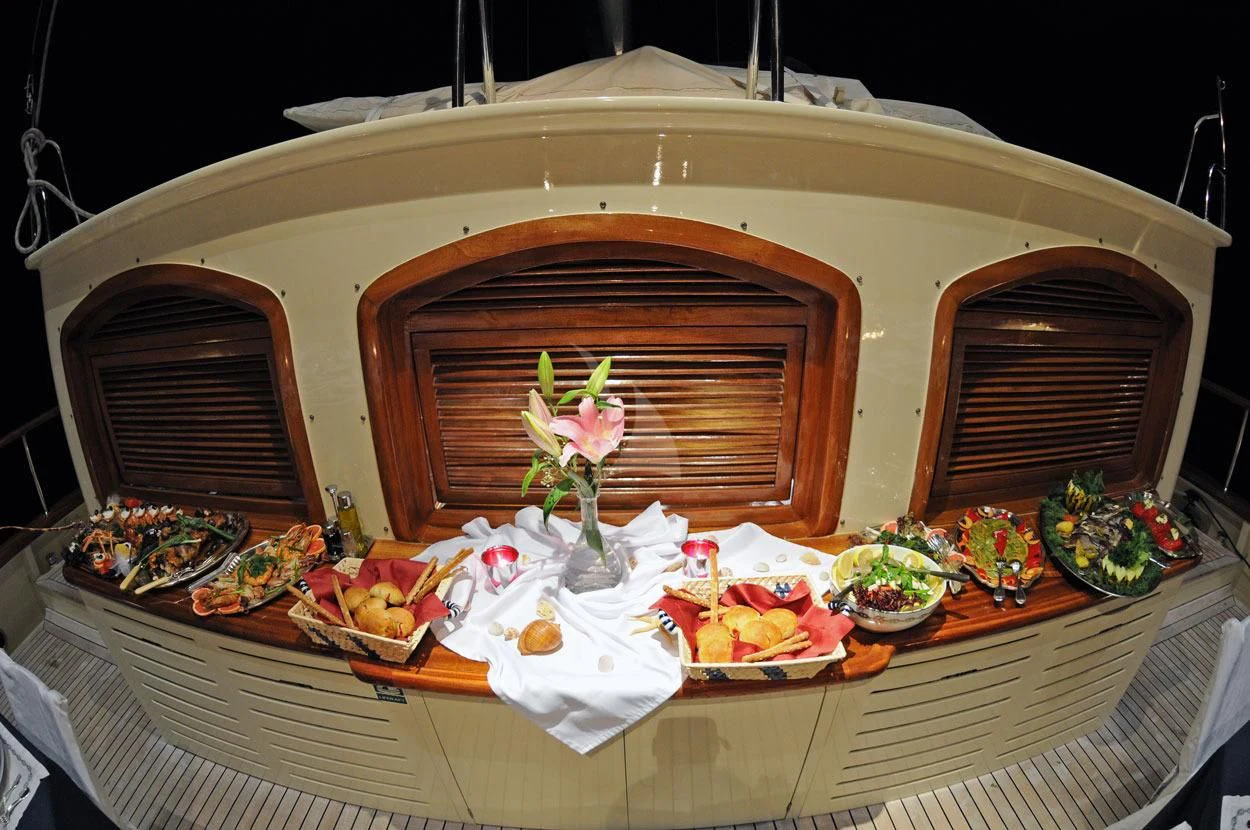 a table with food on it aboard OFELIA Yacht for Sale