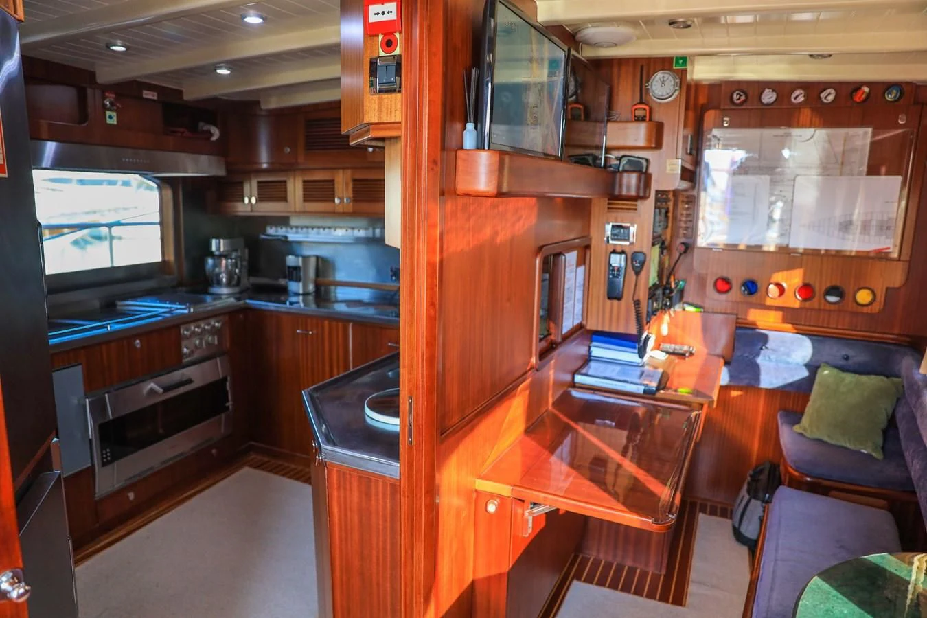 a kitchen with a counter and a microwave oven aboard OFELIA Yacht for Sale