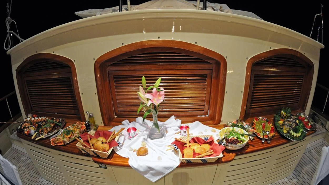 a table with food on it aboard OFELIA Yacht for Sale
