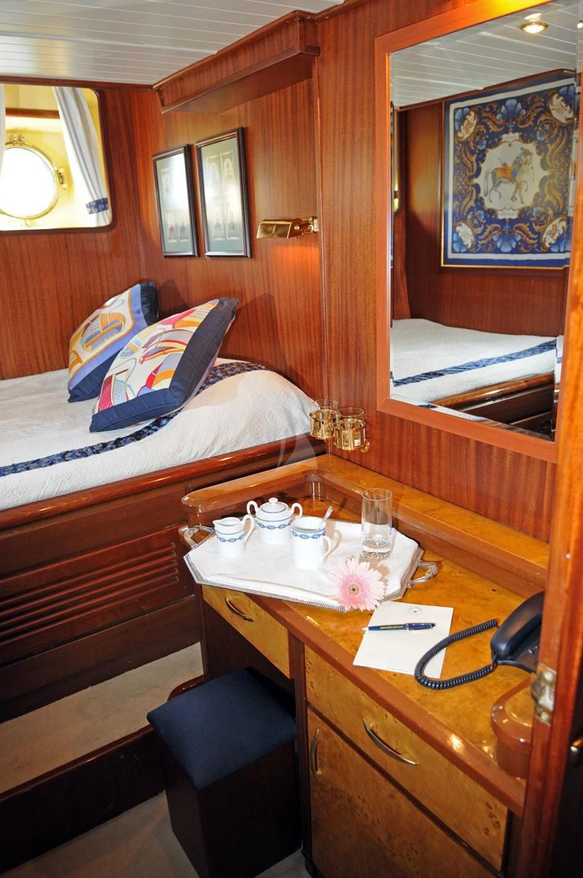 a small cabin with a bed aboard OFELIA Yacht for Sale