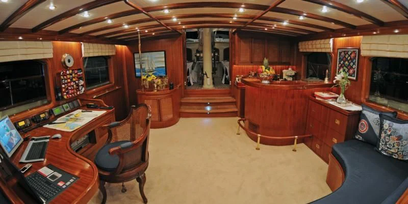 a room with a desk and chairs aboard OFELIA Yacht for Sale