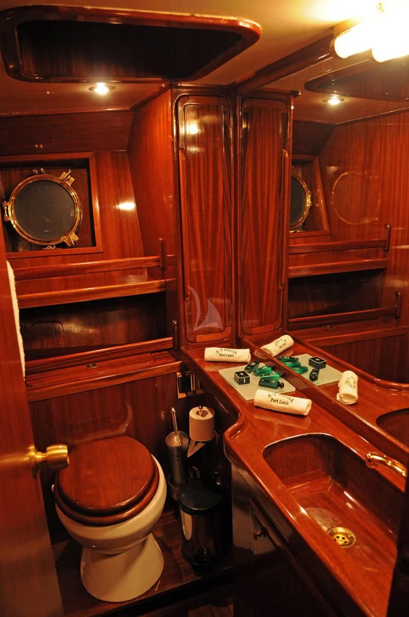 a bathroom with a toilet and sink aboard OFELIA Yacht for Sale