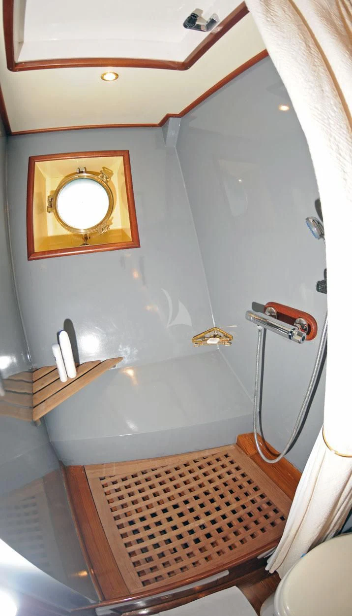 a bathroom with a sink and a mirror aboard OFELIA Yacht for Sale