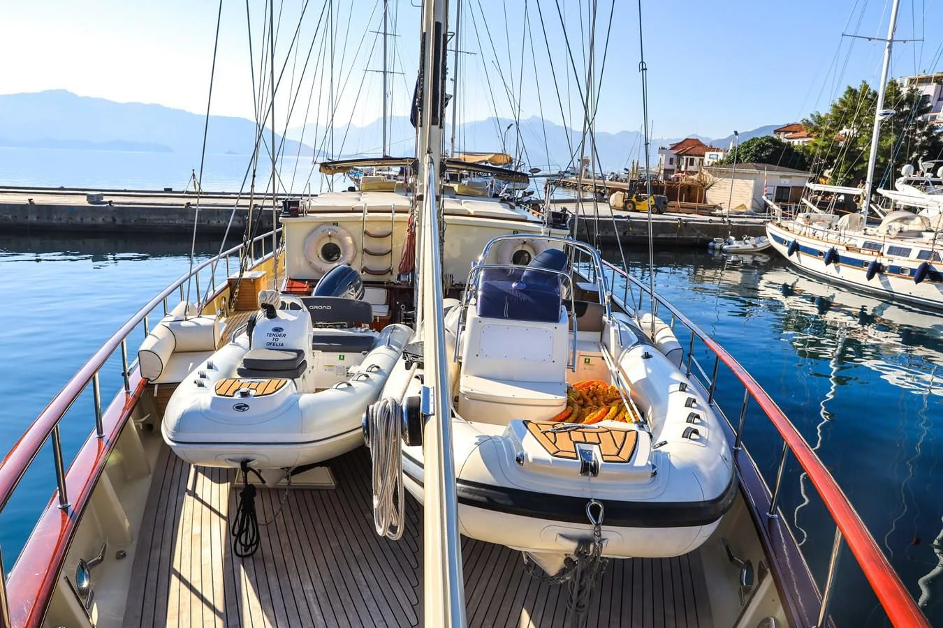 boats docked at a pier aboard OFELIA Yacht for Sale